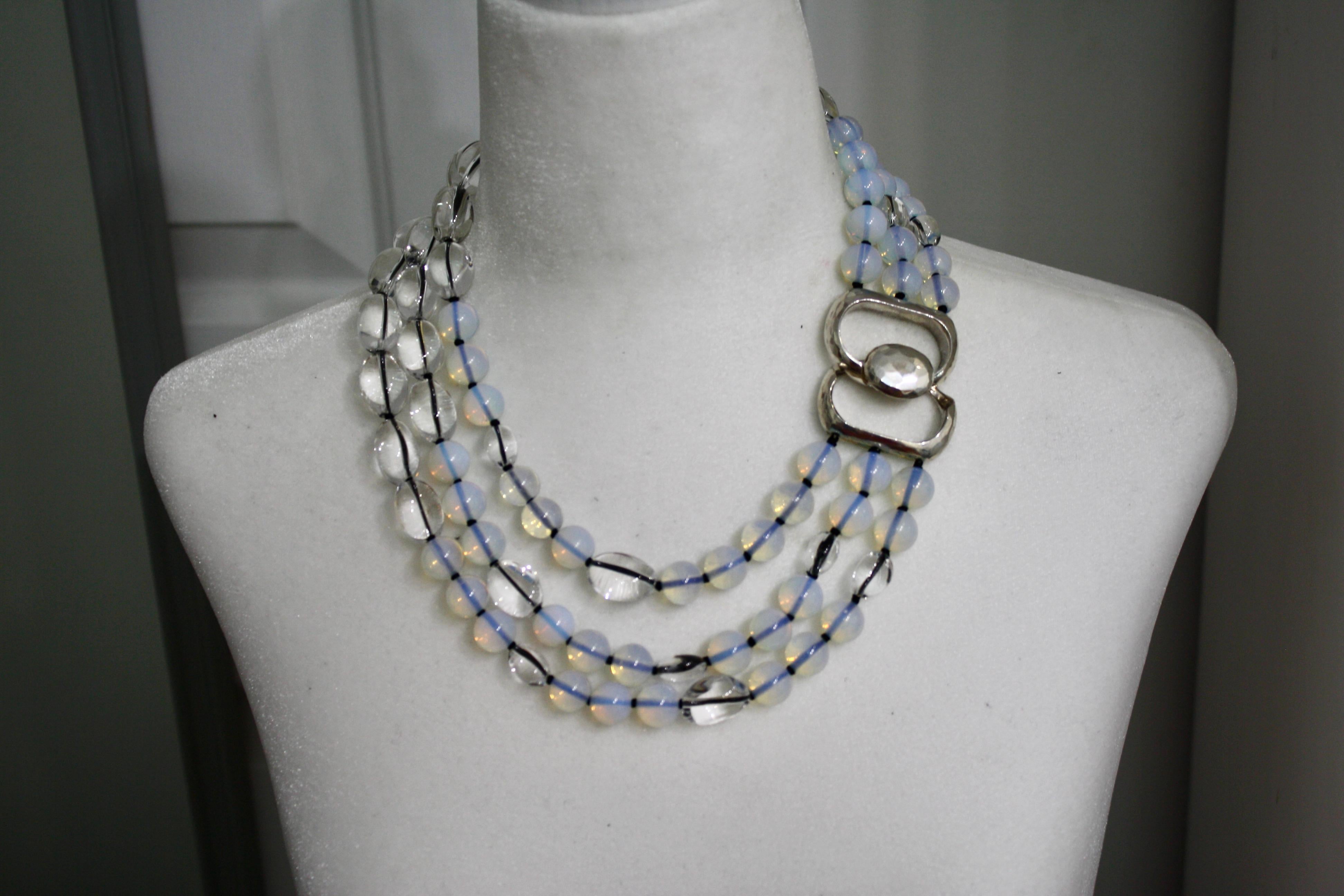 In this one of a kind from Patricia Von Musulin opaline and rock crystal beads are strung on black Japanese silk threads and finished with a sterling silver clasp.