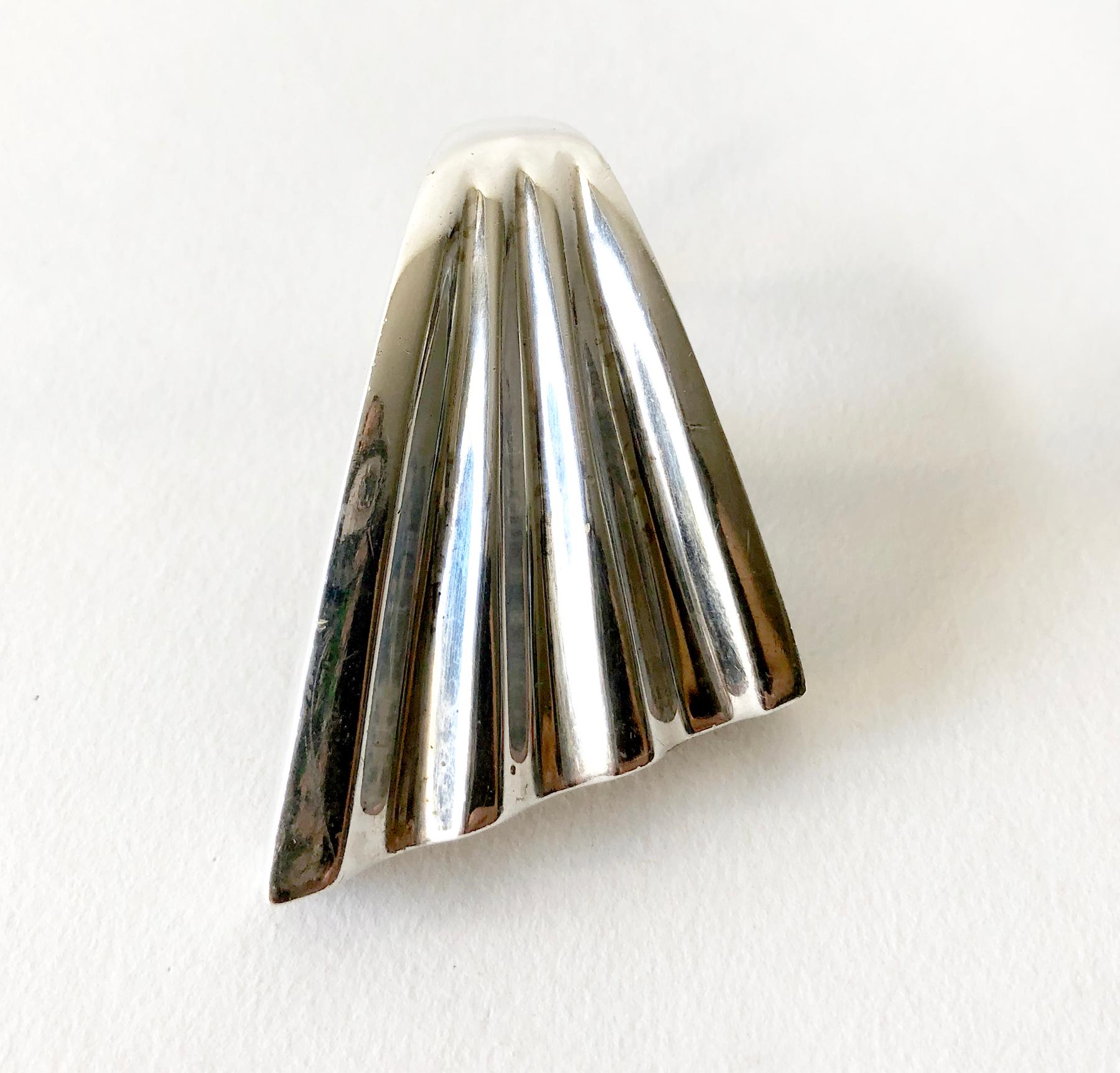 Large scale sterling silver ring in the style of a fluted wing created by Patricia Von Musulin.  Face of the ring measures 1 7/8