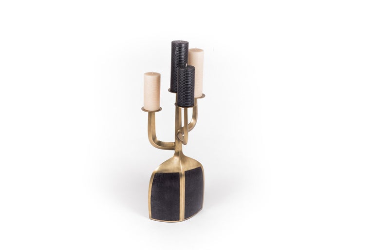 The iconic Patrick Coard pedestal candle base has been updated into a beautiful candelabra with 4 stems to place candles on. Available in XL. Exotic-textured mineral wax candles sold with the piece. The piece is done in bronze patina brass and