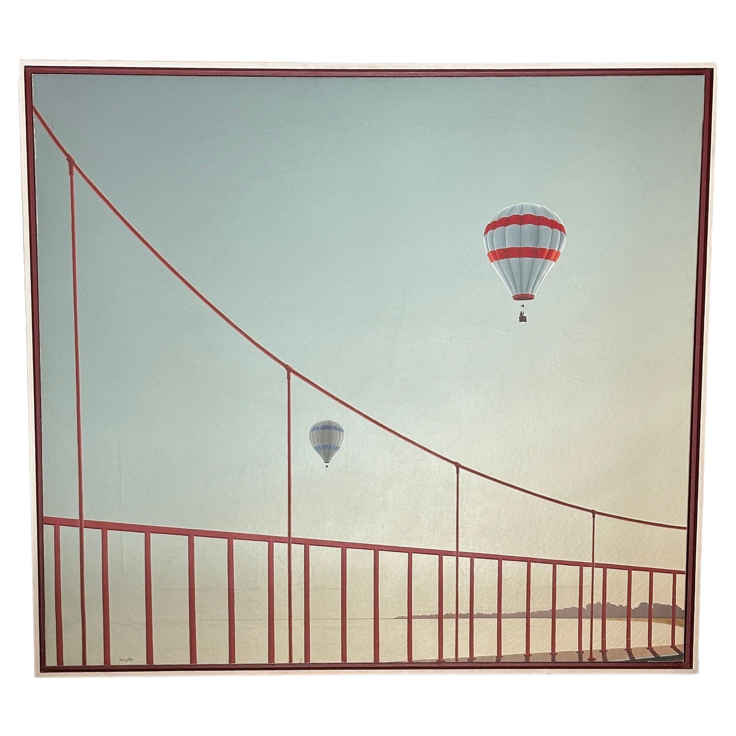 This painting by Patrick Heughe depicts a view of two hot-air balloons floating above the iconic San Francisco bridge. With meticulous attention to detail, Heughe captures the essence of a moment suspended in time, where the bridge meets the