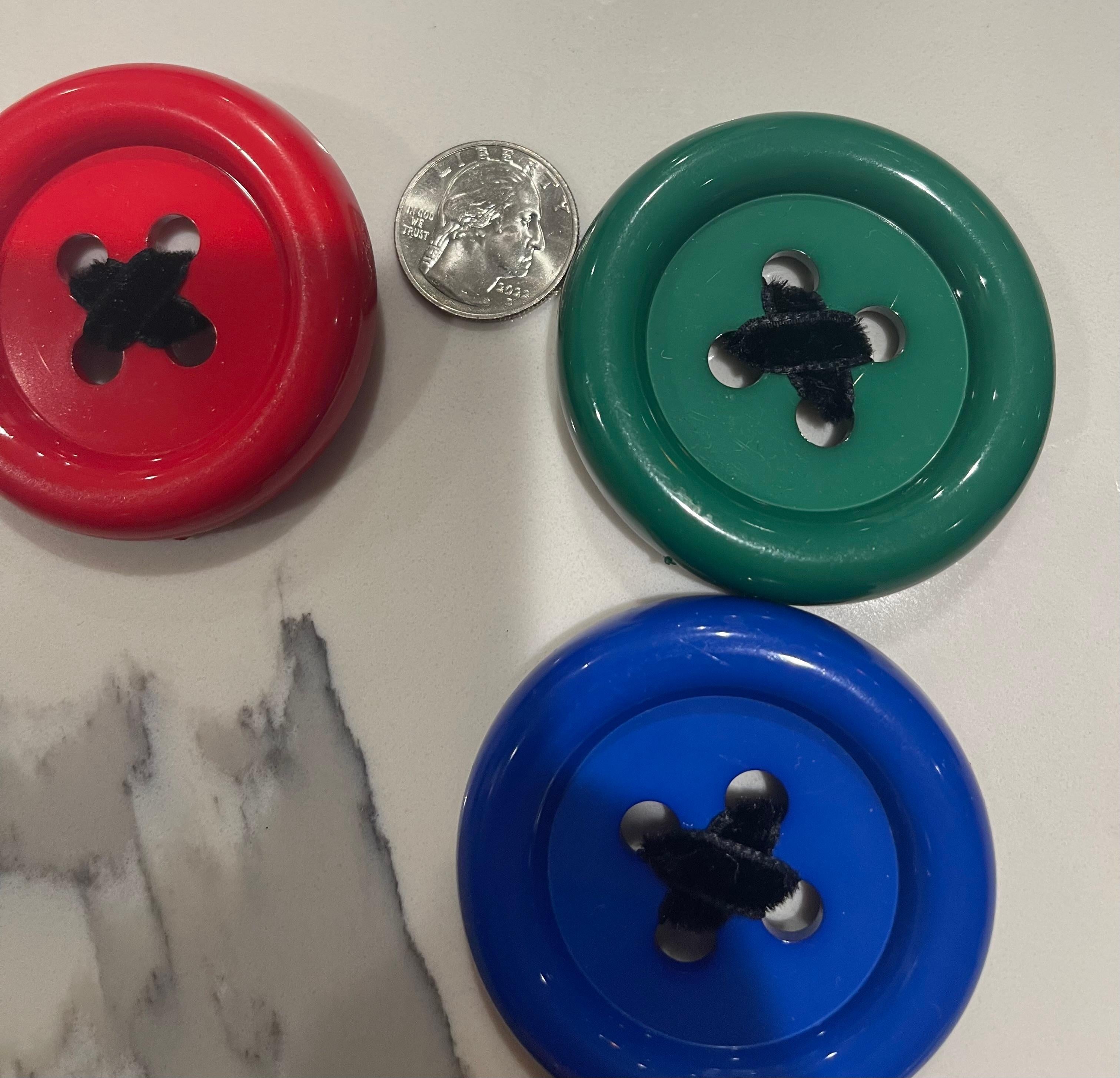Rare 1980s PATRICK KELLY set of 8 large plastic button brooches. Intertwined with black velvet. 
In great condition, and in original clear pouch. This is for all 8.