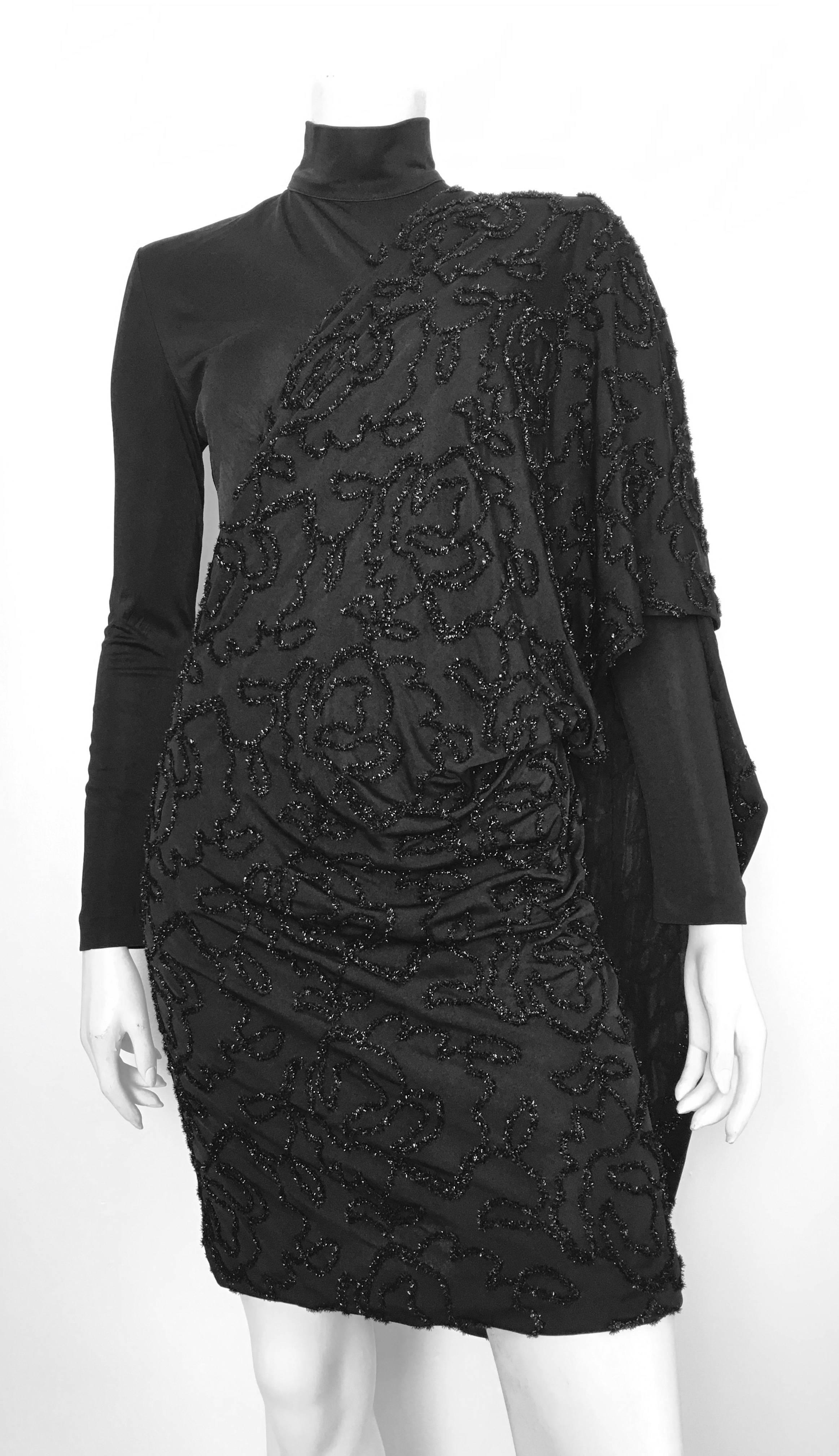 Patrick Kelly 1980s black long sleeves & turtleneck cocktail evening dress is labeled a size 10 but fits like a modern size 4 /6.  This dress is on Matilda the Mannequin and she is a size 4. There is some stretch to it due to the nylon & acetate