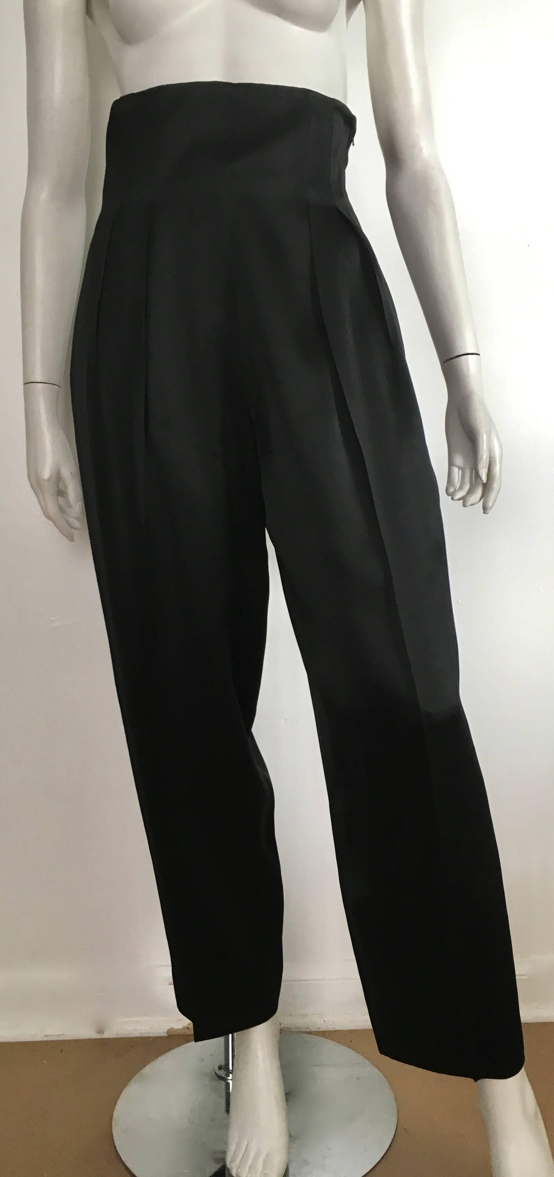 Patrick Kelly Paris 1980s black satin high waisted wide leg evening pants with pockets will fit a size 4/6.  The waist is 28