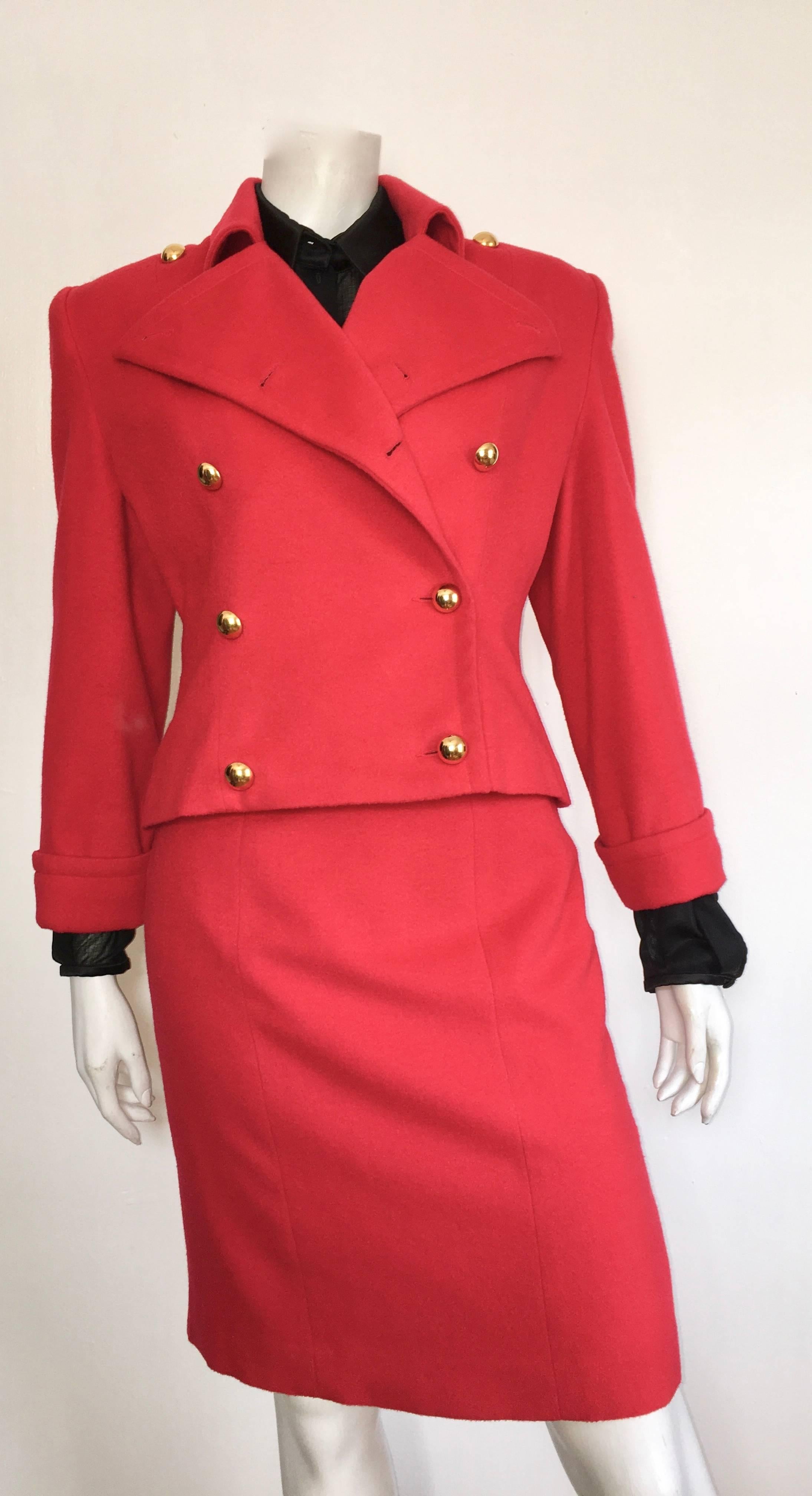 Patrick Kelly 1980s red wool jacket & high waisted skirt is labeled a size 6. The waist in the skirt is 28