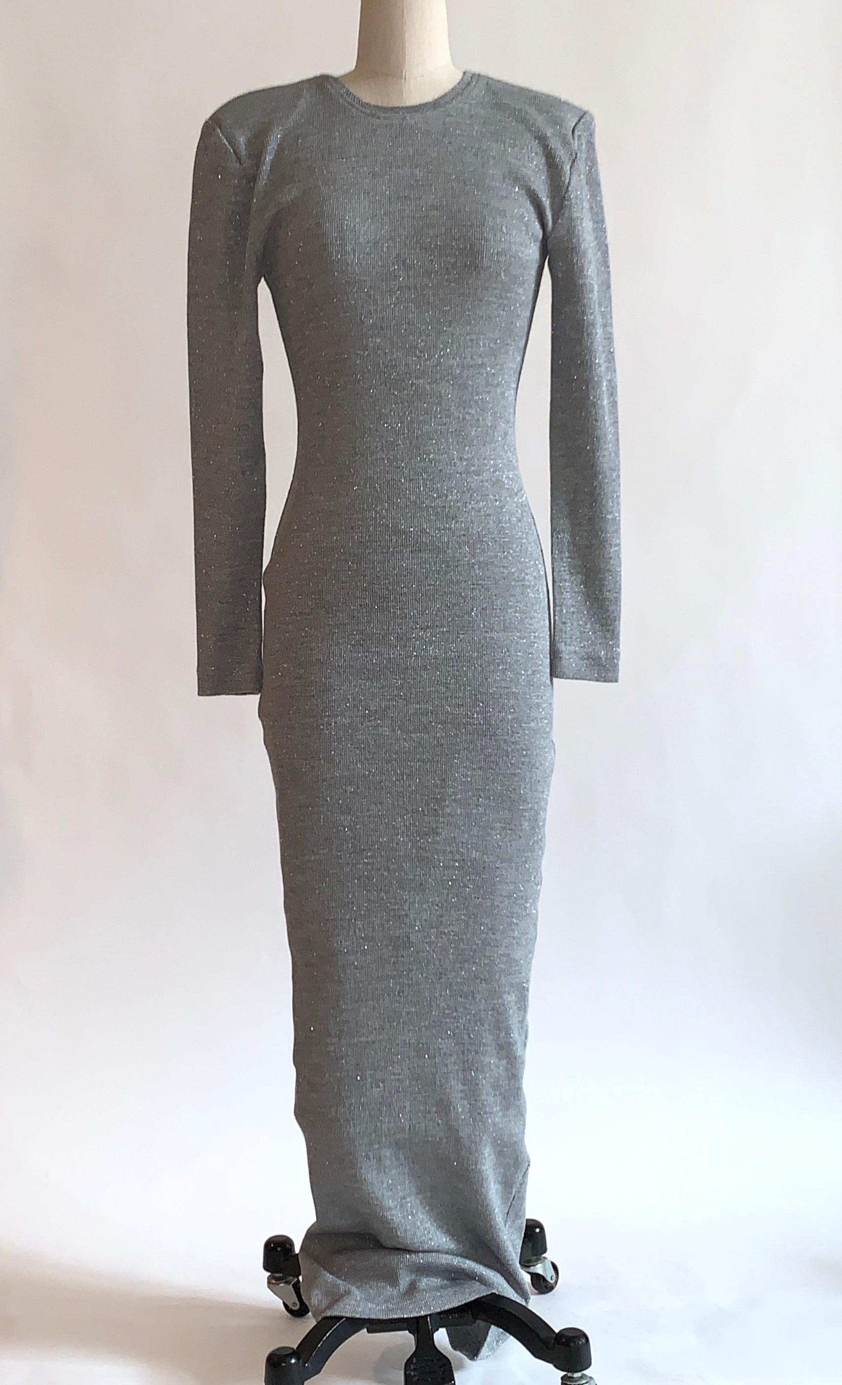 Patrick Kelly metallic silver grey thin rib knit maxi length sweater dress. Light grey with tiny specks of silver throughout. Long sleeves, light padding at shoulders. Pull on. Purchased from an auction of items from the Atelier of Patrick Kelly. 
