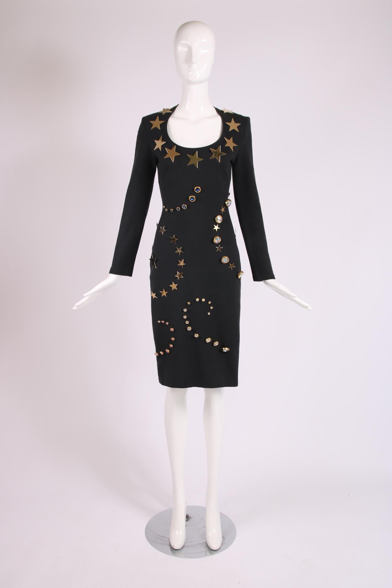 Patrick Kelly black scoop neck bodycon dress w/metal stars and oversized bezel-set rhinestone embellishments. In excellent condition. Fabric is a cotton blend and size tag 6 - please consult measurements.

Shoulders - 16