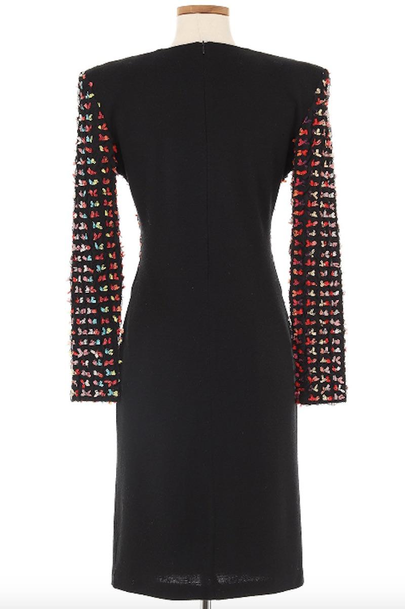 Patrick Kelly Late 1980's Black Knit Dress with Multi Colored Sleeves. Patrick Kelly's designs are nothing short of exciting, he wanted his designs to not only be memorable, but to make people smile. This dress holds a classic silhouette with the