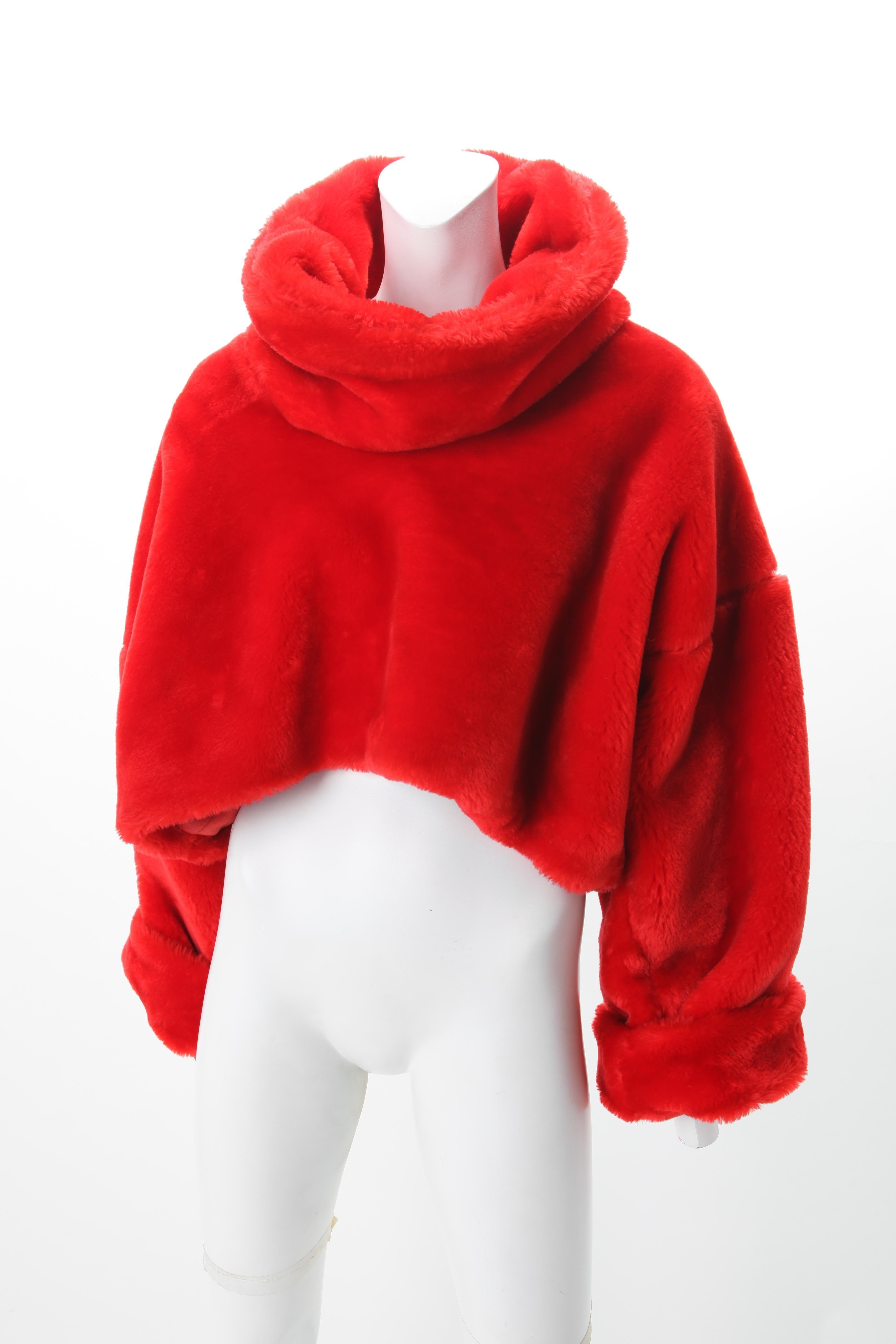 Patrick Kelly Red Faux Mouton Bodice with Funnel Collar, c.1980s.
Patrick Kelly Cropped red faux mouton oversize sweater with funnel collar.

Fit Size US 0 to 6 