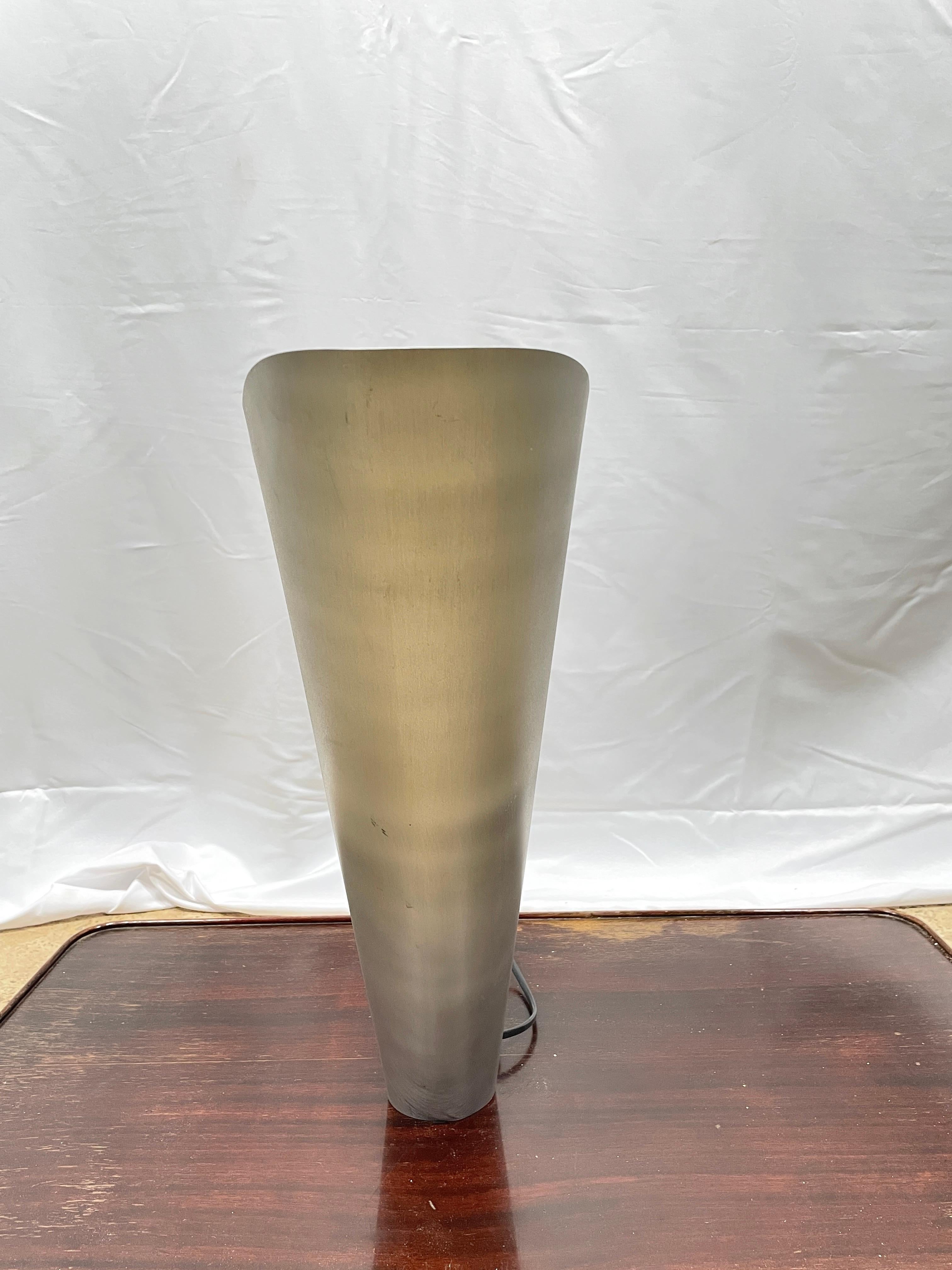 Patrick Manoury (20th)
 Large table lamp model Star composed of a white lacquered aluminum sheet inside embedding a safety glass plate connected by brass balls.
Patrick Manoury was one of Pierre Cardin's valued collaborators in the 1970s and