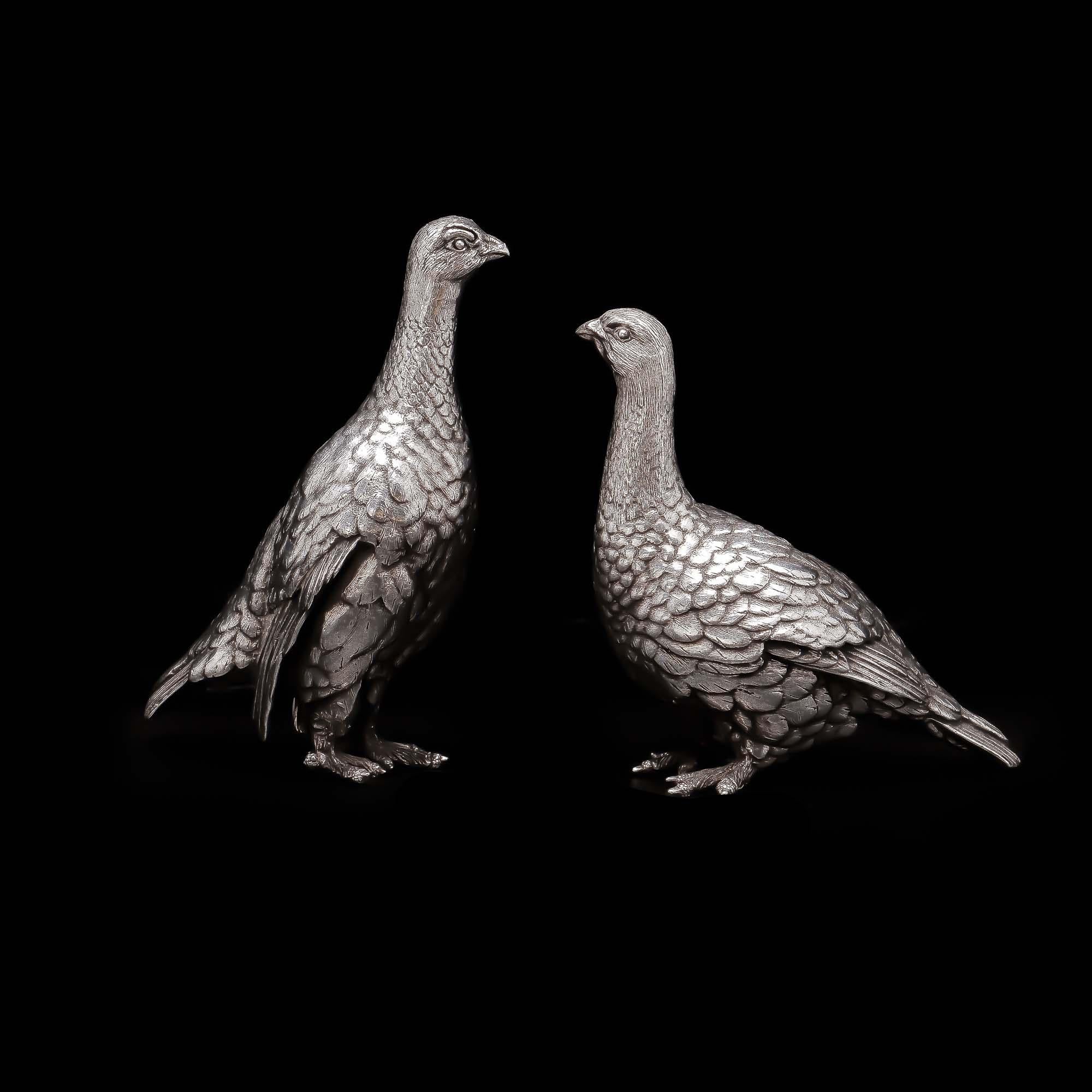A rare pair of Zimbabwean sterling silver bird figurines. Made by acclaimed artist Patrick Mavros, this impressive set depicts a pair of birds nesting while waiting for love to blossom. That's life for bird lovers: waiting... and waiting! If you