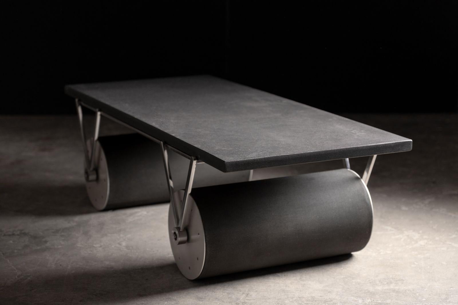 Rare post-modern Cylinder Coffee Table by French Architect and designer Patrick Naggar.
Crafted with a chrome-plated steel frame, granite top, aluminum fittings and sturdy PVC rubber cylinders.
Acquired from the prestigious collection of a former