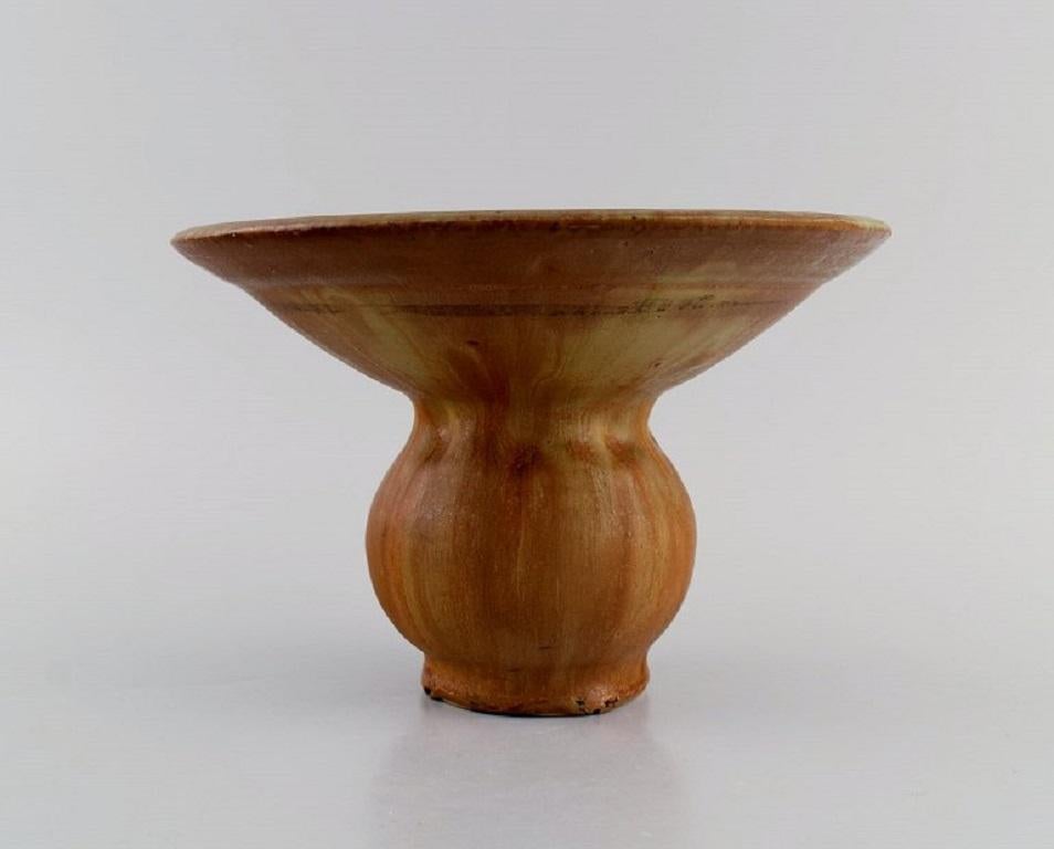 Patrick Nordstrøm / Carl Halier for Royal Copenhagen. 
Antique unique vase in glazed ceramics. Beautiful glaze in light brown shades. 
Dated 1917.
Measures: 21 x 14 cm.
In excellent condition.
Stamped.