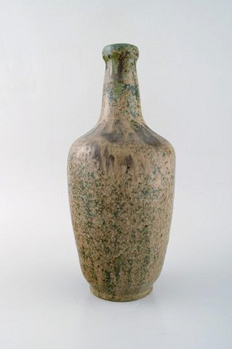 Patrick Nordstrøm for Royal Copenhagen. Large vase in glazed stoneware. Beautiful glaze in blue green tones, 1940s.
Measures: 31 x 14 cm.
Stamped.
In very good condition. 2nd factory quality.