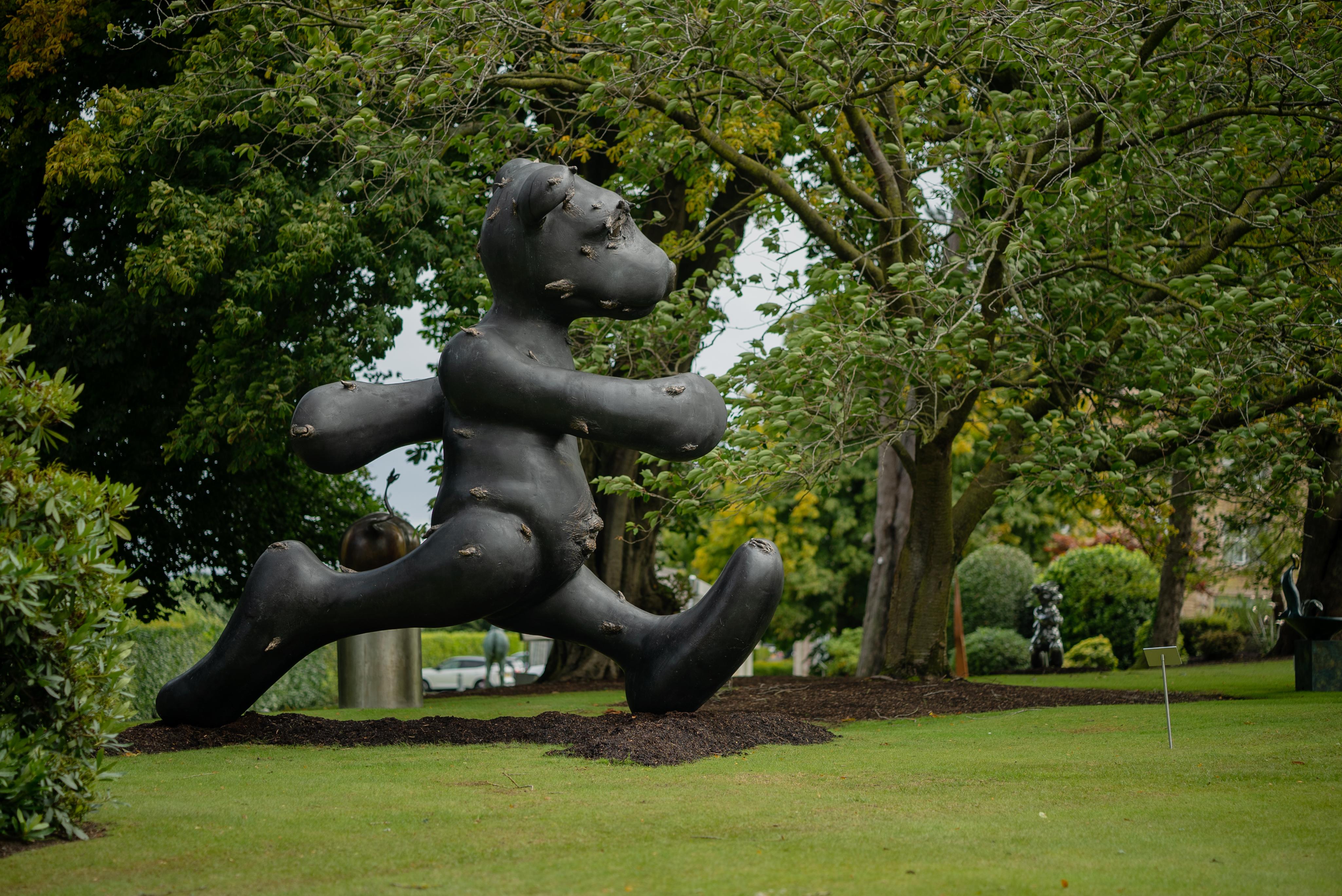 This piece is entitled Larger Than Life as it stands at 4 metres tall. The bear is a running theme in Patrick's work and it references his childhood teddy bear. Patrick wants his audience to reflect on the importance of the sanctity on childhood by