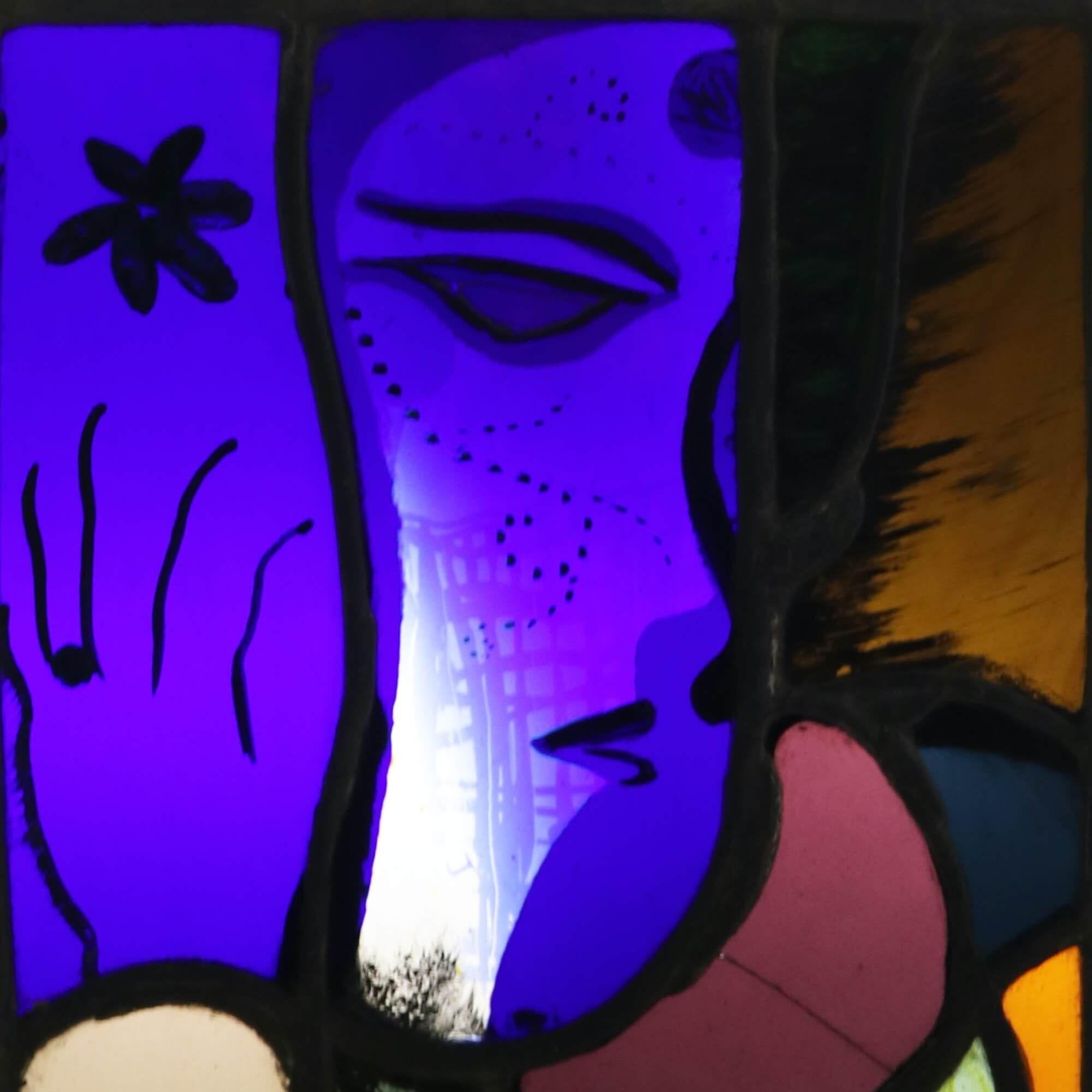 A small modern stained glass panel from the studio of Patrick Reyntiens (1925-2021). Attributed to the artist, this stained glass window depicts a figurative design with abstract hand painted details and vibrant colours. It is one of various stained