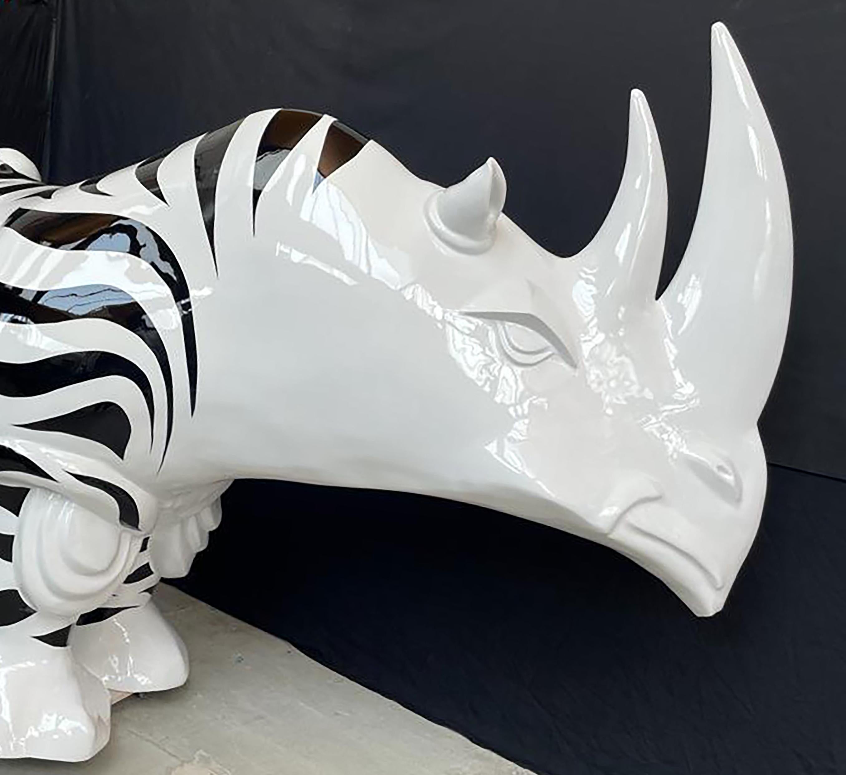 Rhinozebros is a resin sculpture made by Patrick Schumacher, a French contemporary artist. This sculpture represents a rhinoceros adorned with a zebra skin. 
