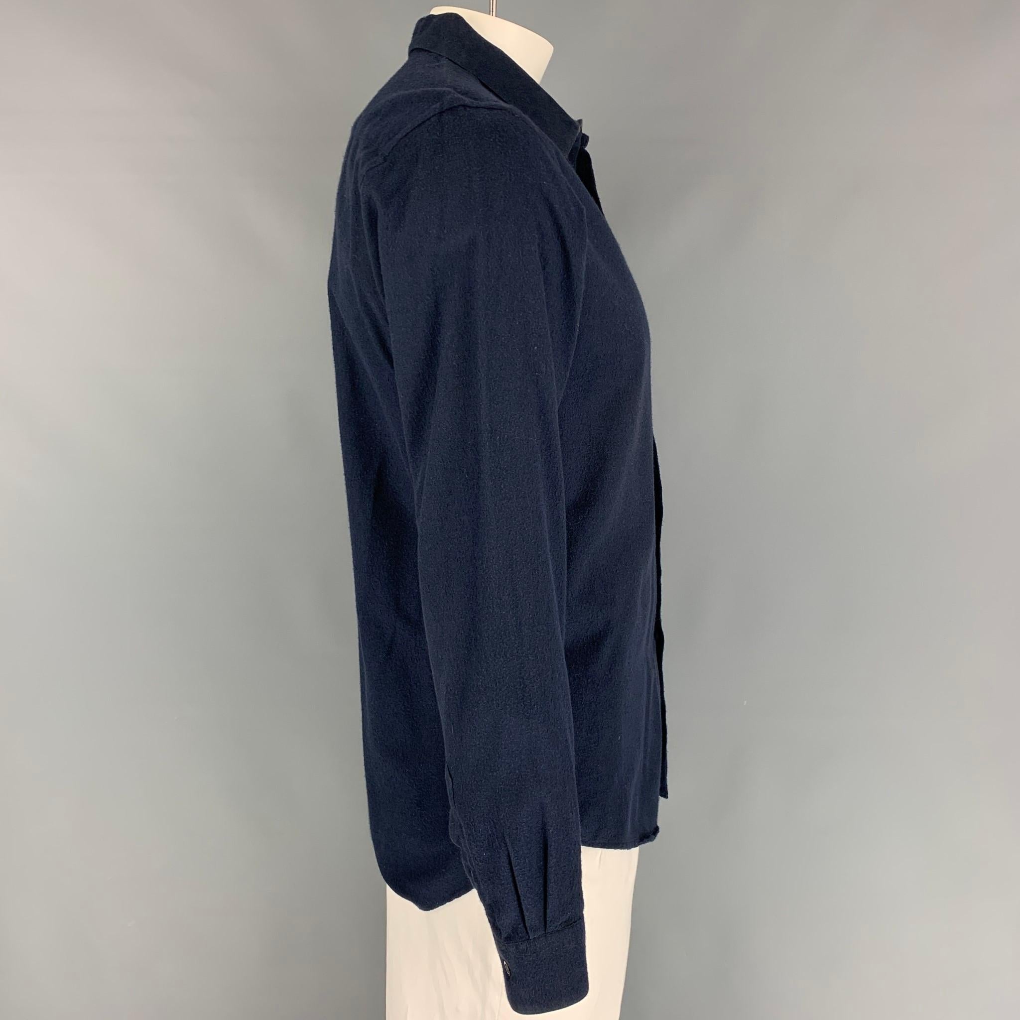 PATRIK ERVELL long sleeve shirt comes in a navy cotton featuring a spread collar, patch pocket, and a buttoned closure. 

Very Good Pre-Owned Condition.
Marked: XL

Measurements:

Shoulder: 18.5 in.
Chest: 42 in.
Sleeve: 26.5 in.
Length: 30.5 in. 