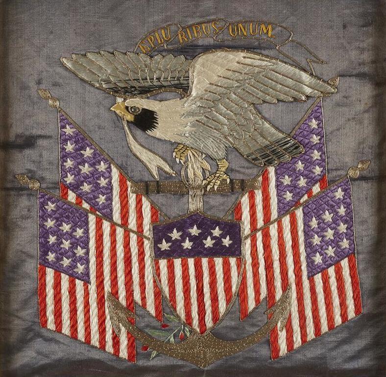 Presented is a patriotic silk floss and metallic thread embroidered souvenir, circa 1909. The banner has a slate blue silk field, with 