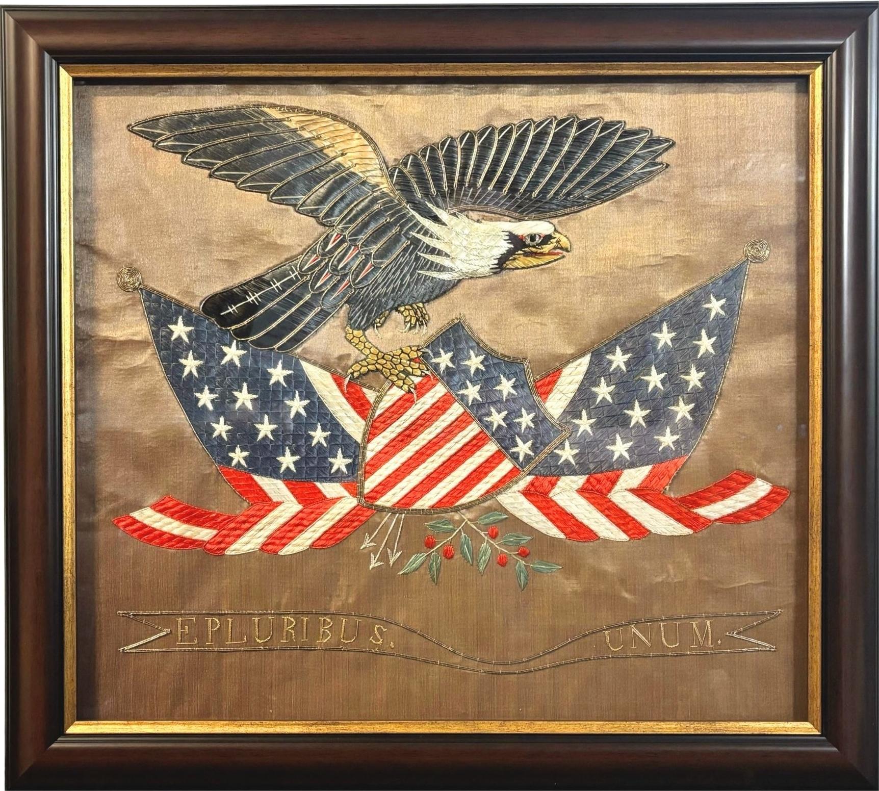 Presented is a patriotic silk and metallic thread trapunto embroidered souvenir, dating to the late 19th century. The banner has a tan silk field, with 