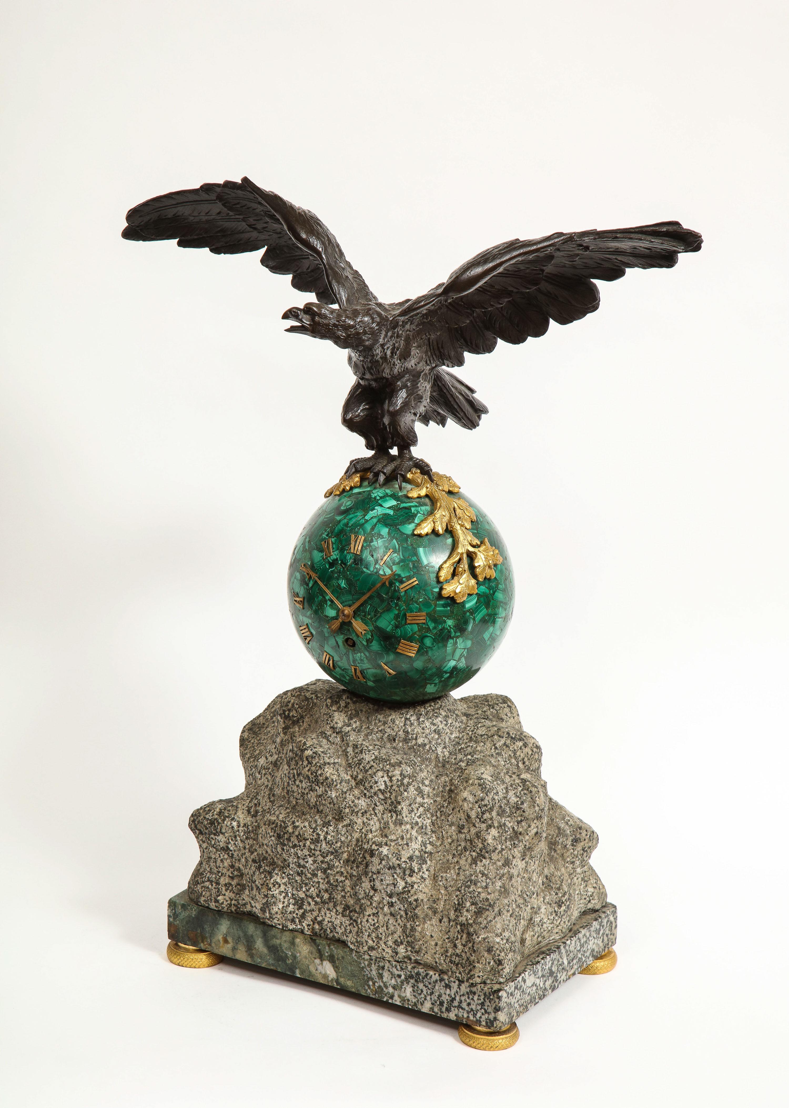 Patriotic French patinated bronze eagle and malachite clock on granite base, 1889.

Very nice clock with patinated bronze flying eagle sitting on a round malachite globe-form clock. 

Unique piece. Clock with Roman numeral numbers sitting on a