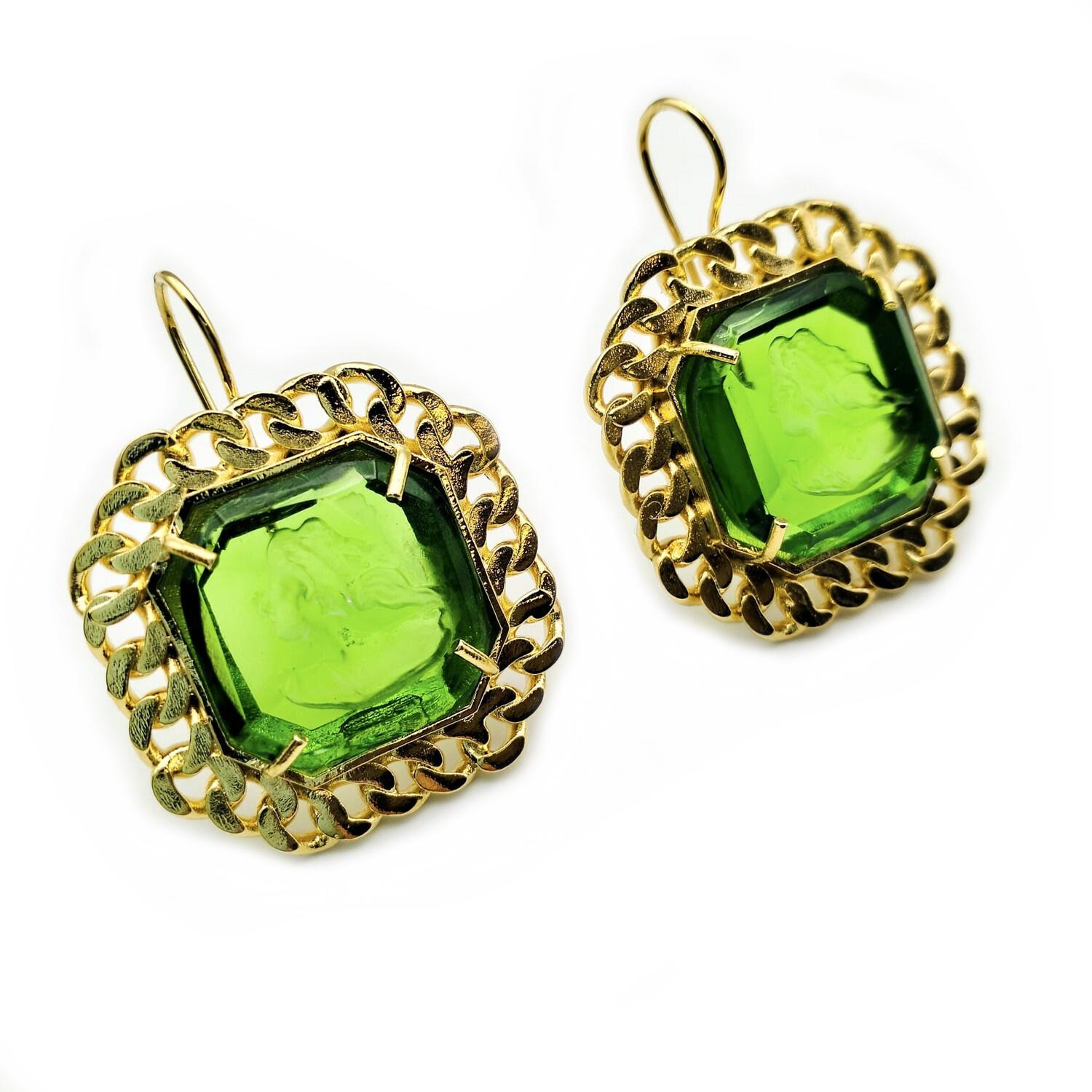 Patrizia Daliana earrings in 24 KT gilded bronze with hand-cut Murano glass depicting an ancient Roman woman's head and glass crystals. Emerald green color with Chanel frame style bezel finishing. To wear it to the ear, a suitably shaped bronze wire