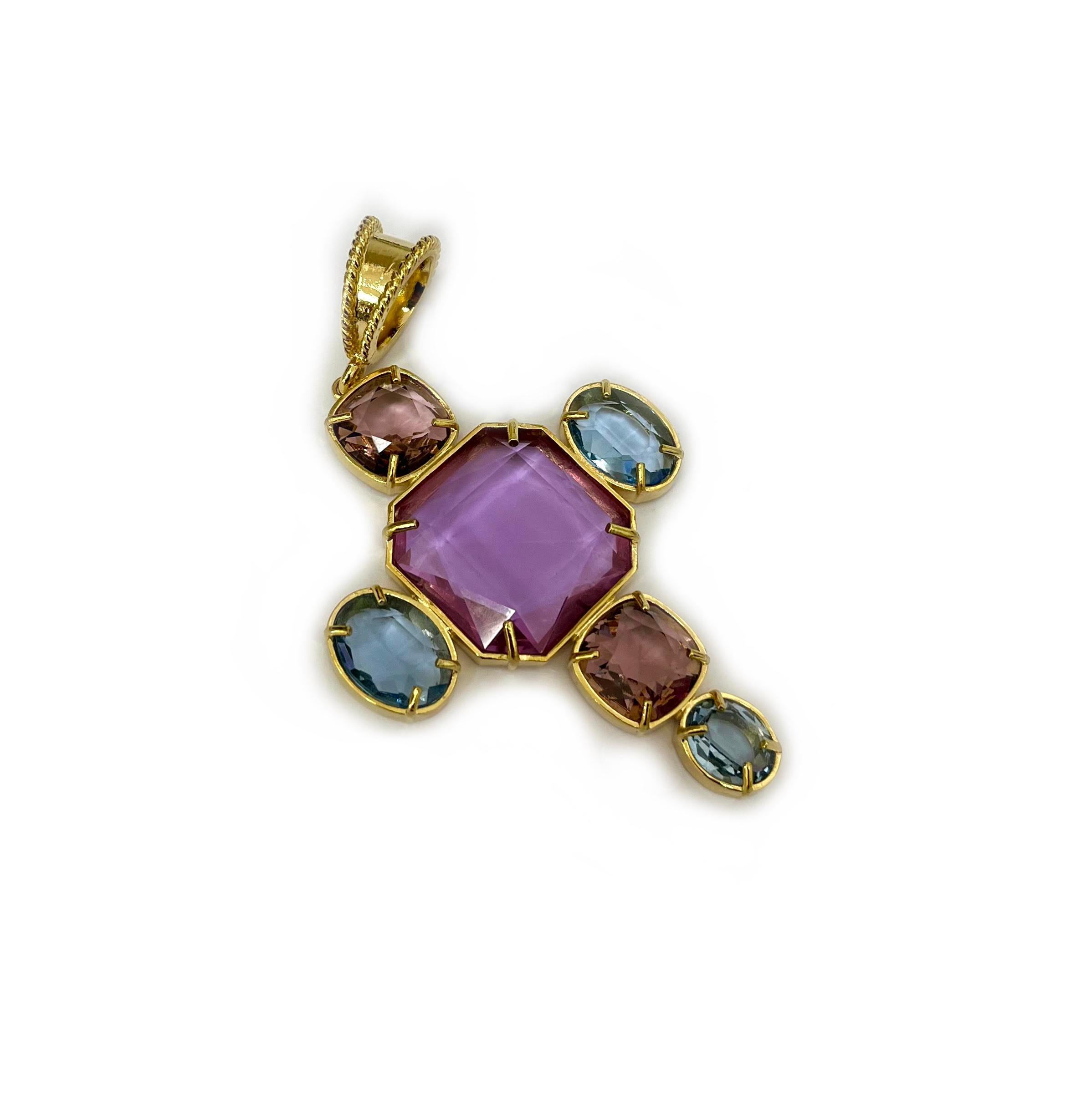 Patrizia Daliana Pendant in 24kt gold-plated bronze in the shape of a cross with zirconia and faceted crystals. The micro-cast loop adapts to all models of our chains. To fix the stones to our jewels, according to the Italian goldsmith tradition, we