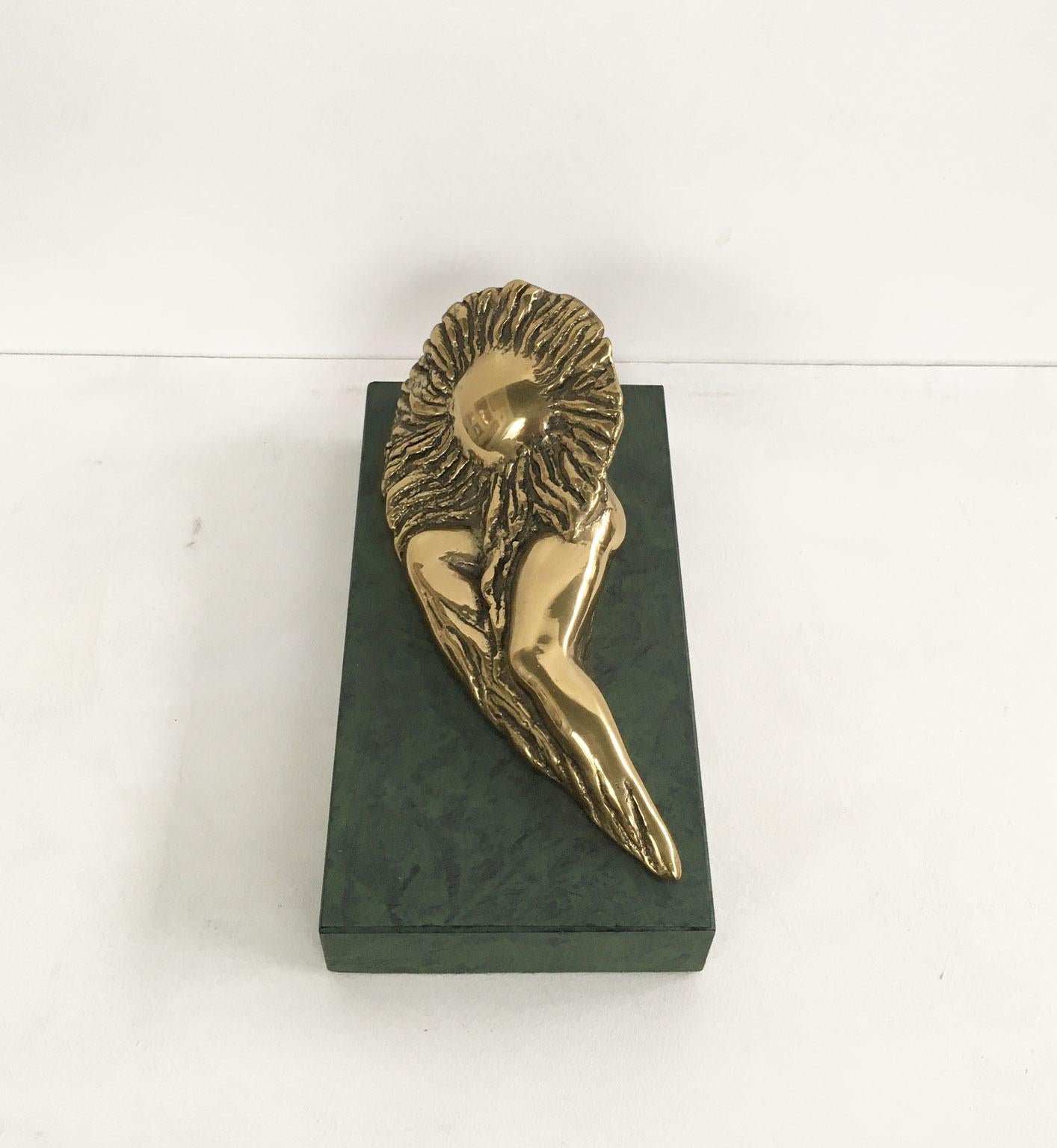 This is an engaging bronze sculpture create by the Italian artist Patrizia Guerresi, in the 1986. The piece is a multiple of 1000 specimen on a green painted wooden base. The title of this artwork is"Donnasole" translate in Sun Woman. 

Patrizia