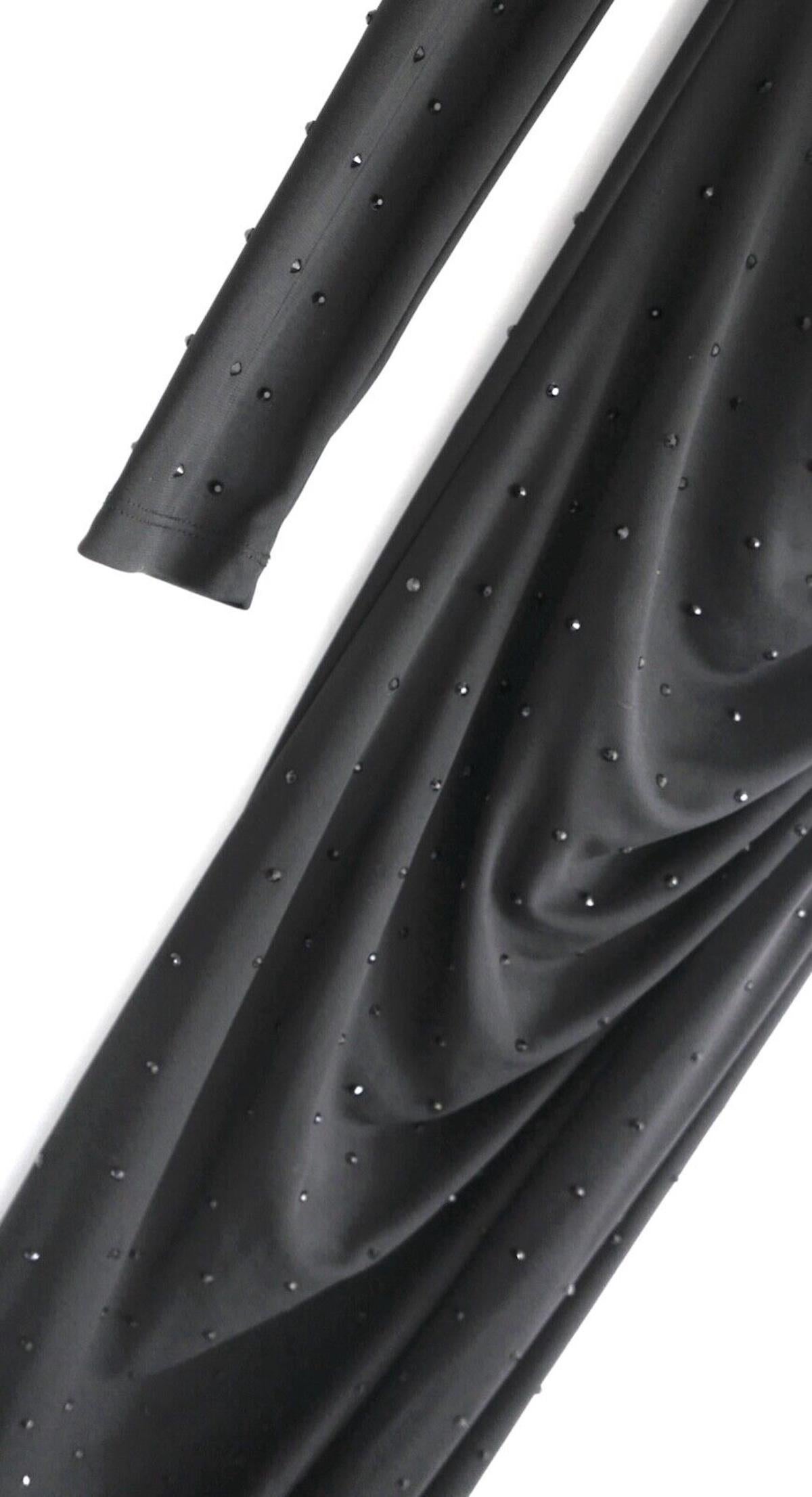 Subtle glam Patrizia Pepe crystal embellished evening dress. Bought for £650 and new with tags. Made from a double layer of soft and stretchy black polyester and elastane with tonal crystal embellishments throughout. It has a one sleeve cut with