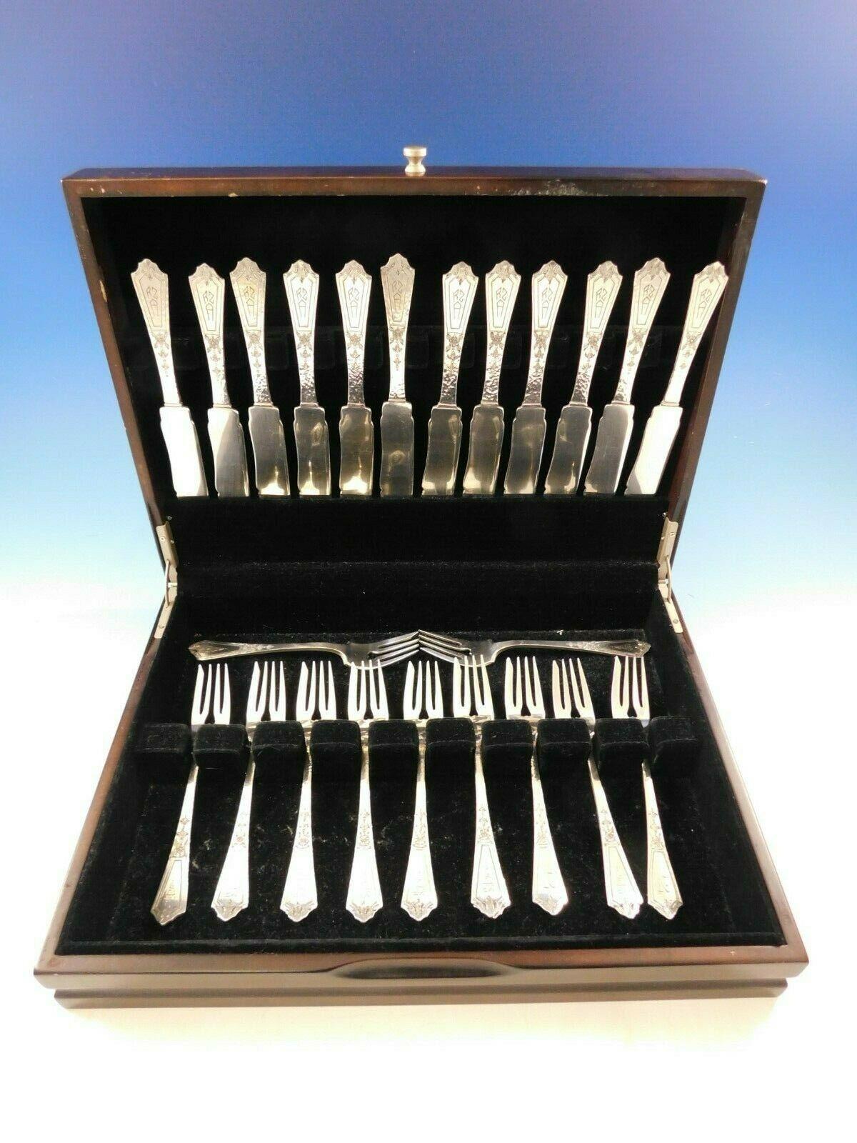 Pattern A by Gorham

Incredible sterling silver fish set in the pattern Pattern A by Gorham. This 24 piece set features a subtle hammered finish and includes 12 fish knives and 12 fish forks. Each piece has a lovely small flower beneath the