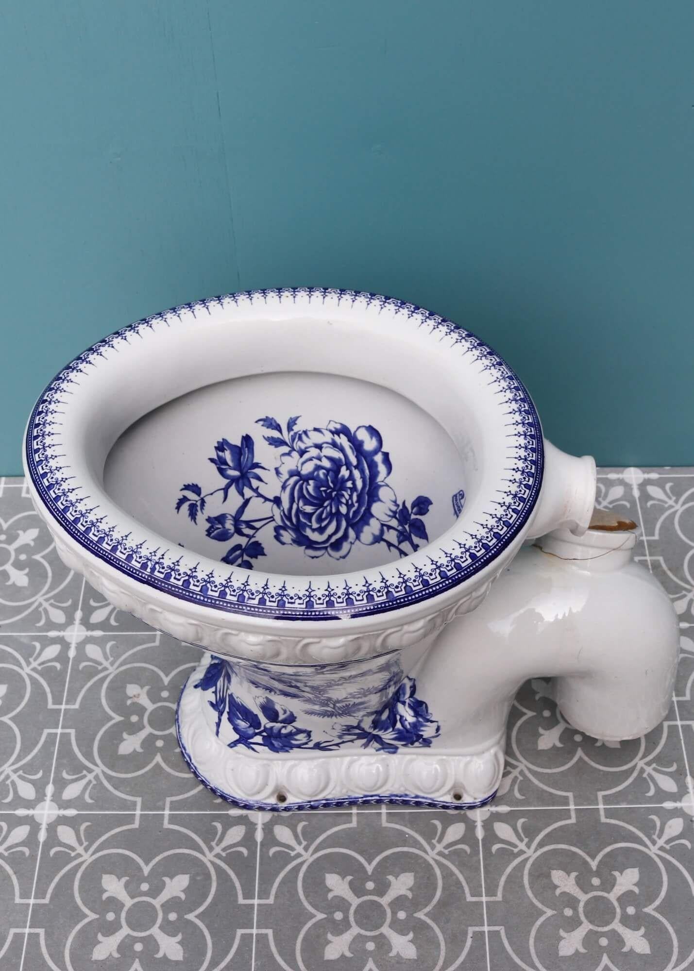 The Excelsior was a famed model of its time. Dating from the 1880s, this English Victorian toilet is perfect for recreating a Victorian bathroom or restroom. It features an attractive blue and white patterned bowl and decorative moulding to the