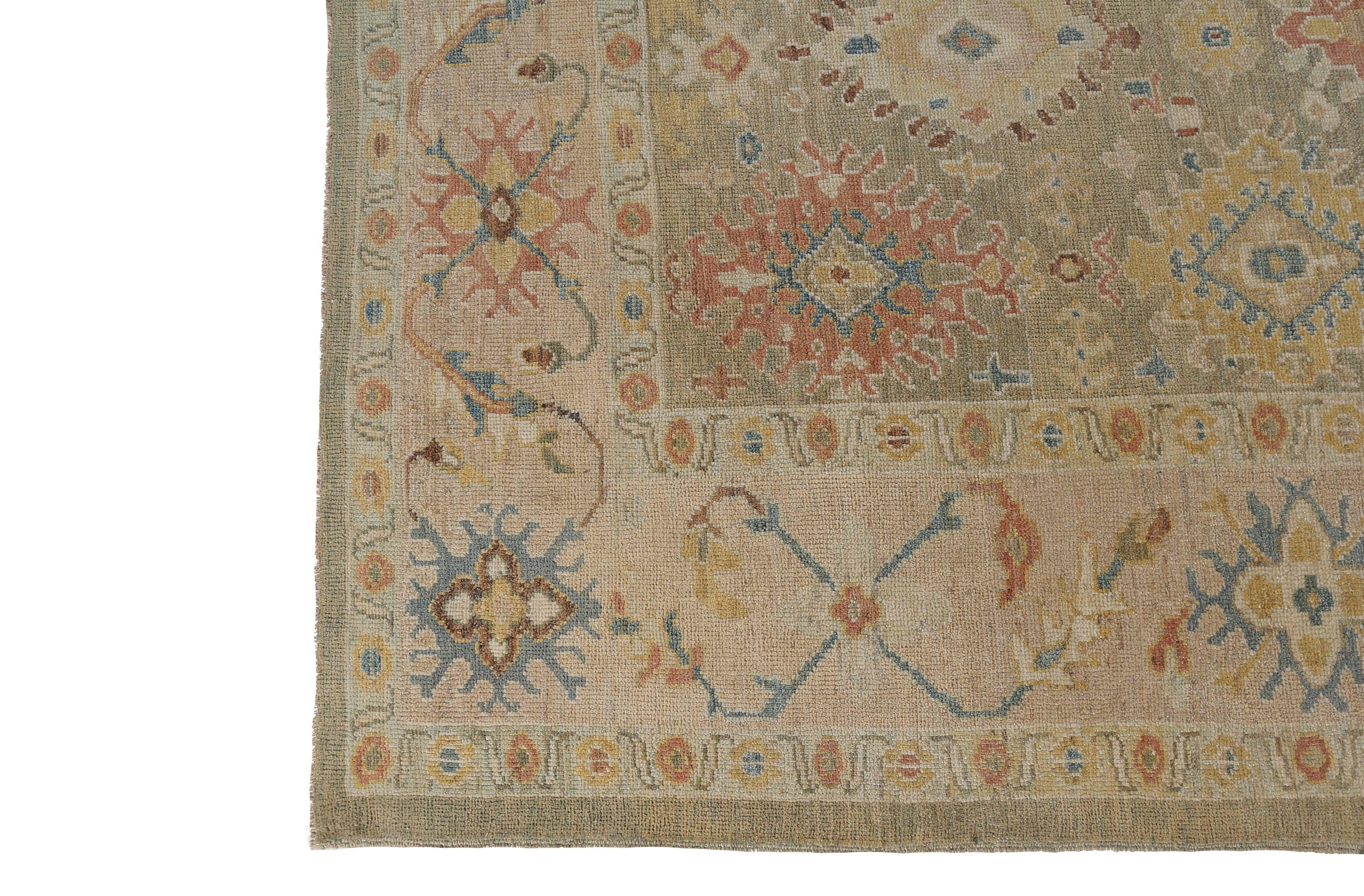 This handmade Turkish Sultanabad rug is a stunning addition to any home decor. Measuring at 8'1