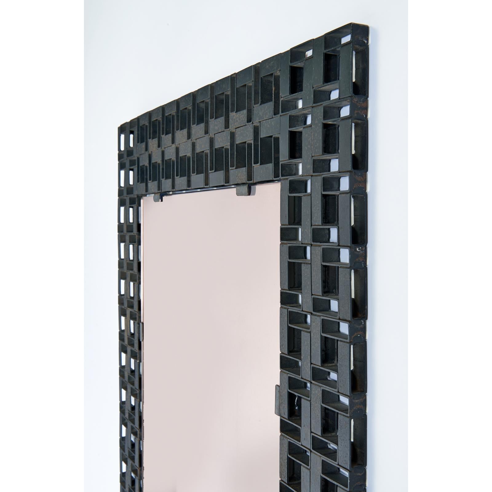 Italy, 1970s
Worked iron mirror with geometric interwoven links. Tinted mirror
Dimensions: 39 H x 26 W.
