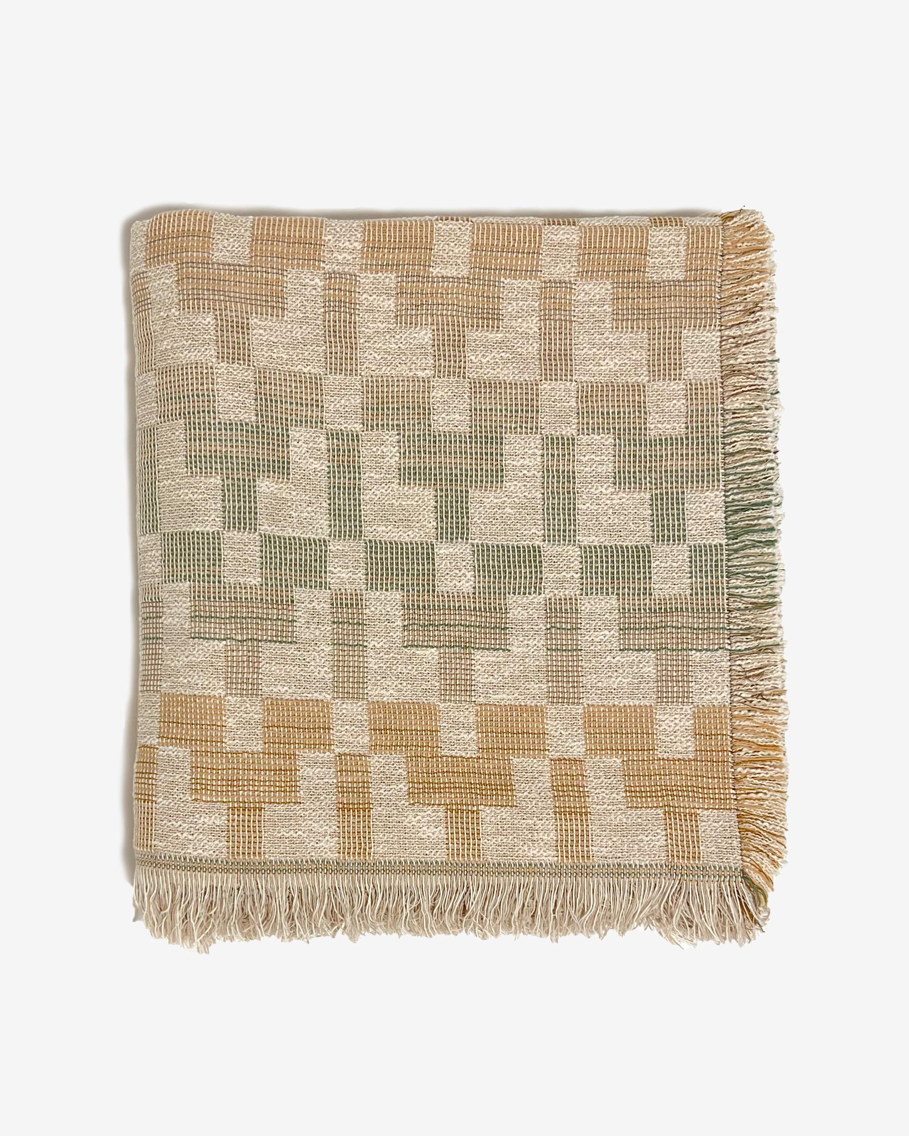 The 'Esme' bedspread is designed by Folk Textiles—a LA based brand dedicated to thoughtful living. This textile is woven in the UK using sustainably-dyed organic cotton from Italy. 

The 'Esme' pattern in particular is inspired by the ceremonial