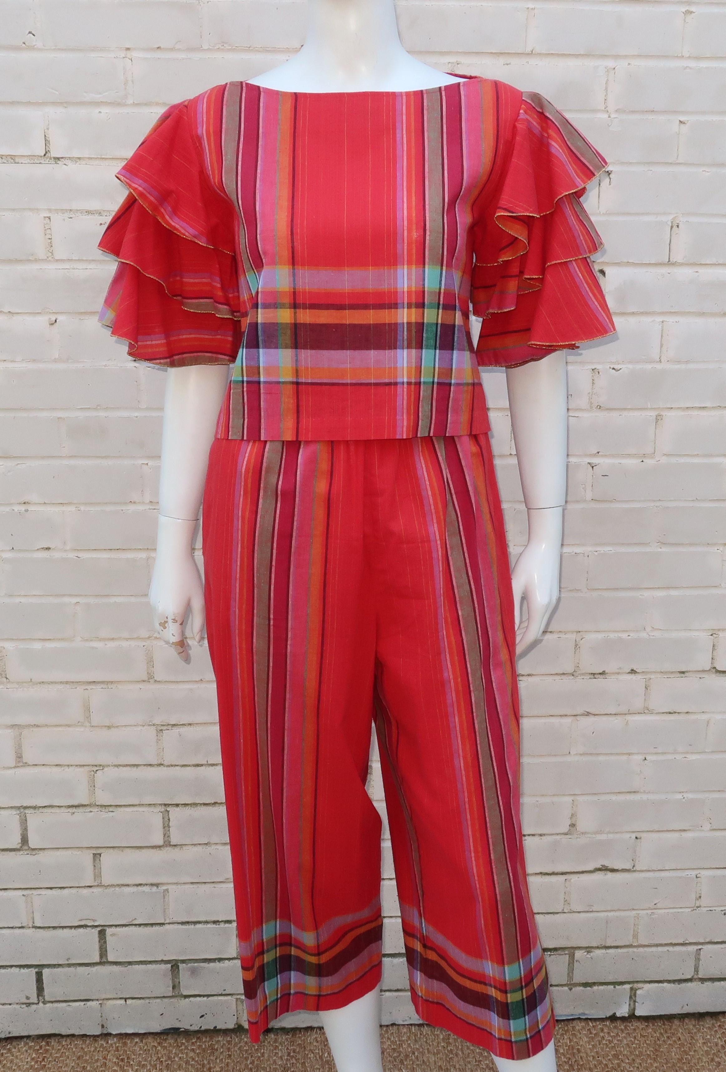 Transplanted New Yorker, Patti Cappalli, made a name for herself in California during the 1970's designing fun sports and leisure wear.  This adorable two piece pant suit is made from a festive madras plaid cotton in shades of red, orange, green and