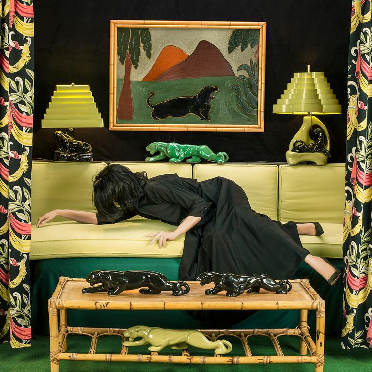 Panther by Patty Carroll is a staged photograph of a mannequin, representing a woman, laying on a couch in a panther themed room. 

This photograph is listed as a 22 x 22 inch archival pigment print, with the paper size measuring 30 x 30 inches. It