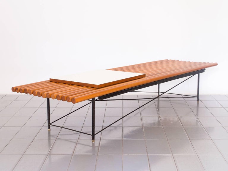 Amazing 1950's bench made of Pau Marfim rods / slats. Formica table top is fixed to the side, and wrought iron holds everything together in a very light structure.

In 2017, we discovered a collection of Mid-Century Modern pieces in a house in front