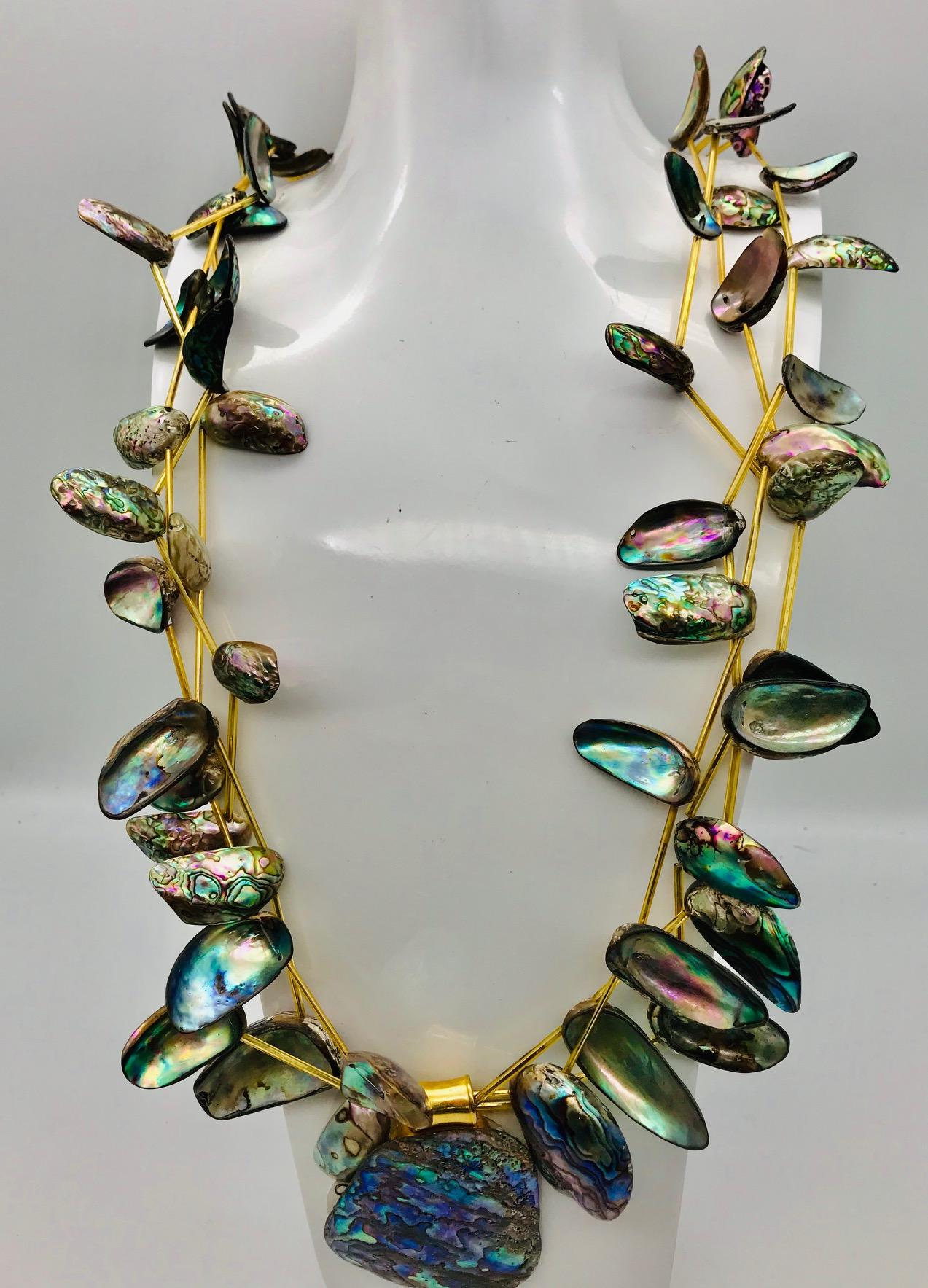 3 strand Statement Necklace created with baby Paua /Haliotis beads with gold infused Venetian glass spacers.This glamorous  design was made with graduated Paua /Haliotis shells in their natural color which ranges from pink to green with flashes of