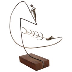 Paul A. Lobel Escultura cinética de pescador de plata de ley