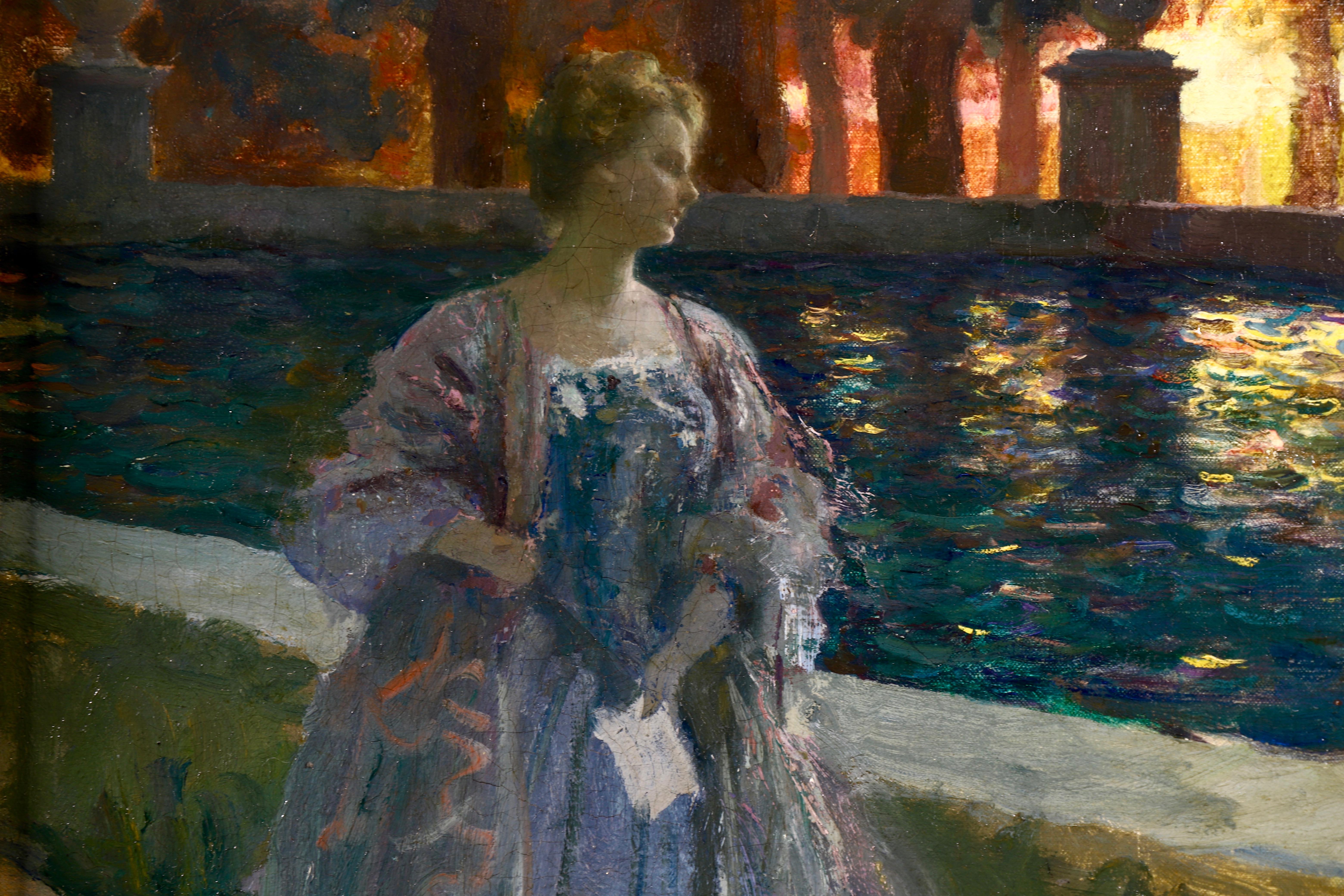 A beautiful oil on canvas circa 1910 by French painter Paul-Albert Laurens depicting an elegant woman in a blue dress standing beside a pool of water in a garden at nighttime as the sun sets behind the trees.

Signature:
Signed lower