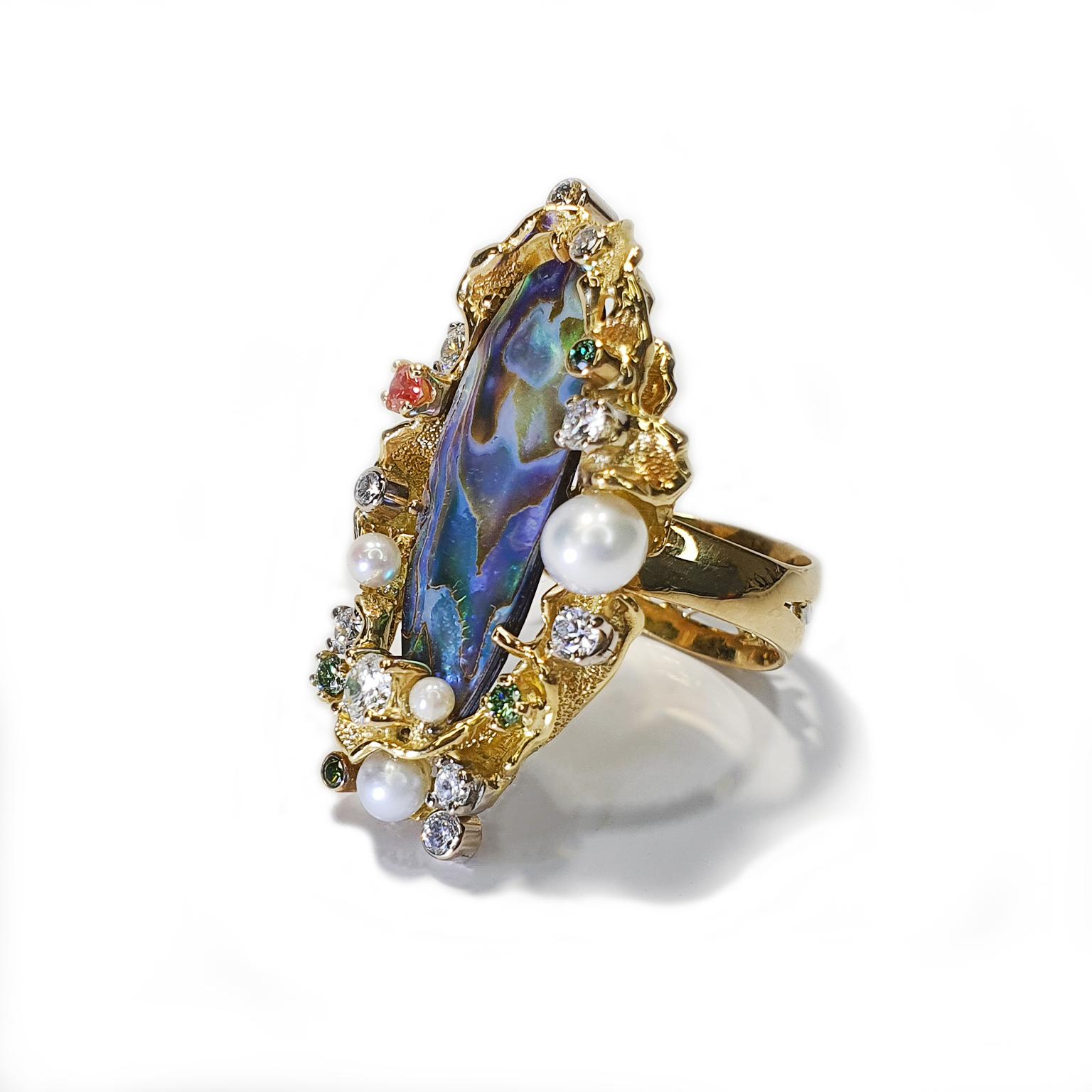 The “Pacific Opals” ring was designed and hand crafted by multi award-winning jeweller Paul Amey in Australia. Stamped with his registered makers mark and precious metal marks, “Pacific Opals” ring was designed and completed with over 22 hours of