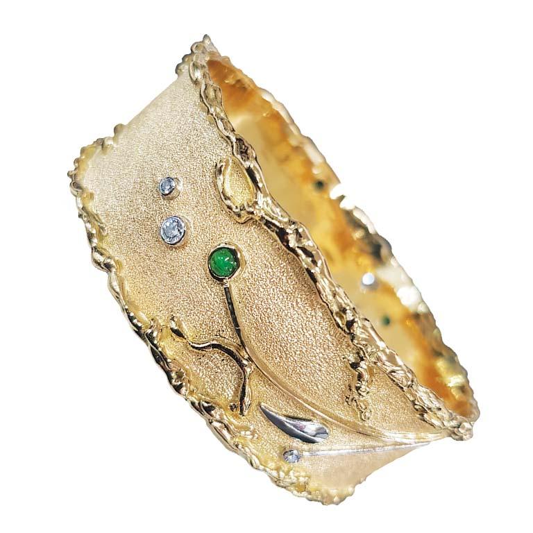 Paul Amey’s bangle is a totally unique and completely handcrafted and created by Paul Amey. This signature molten edge natural tsavorite, tourmaline and diamond bangle was crafted from 18K yellow gold and platinum.  This molten edge bangle features