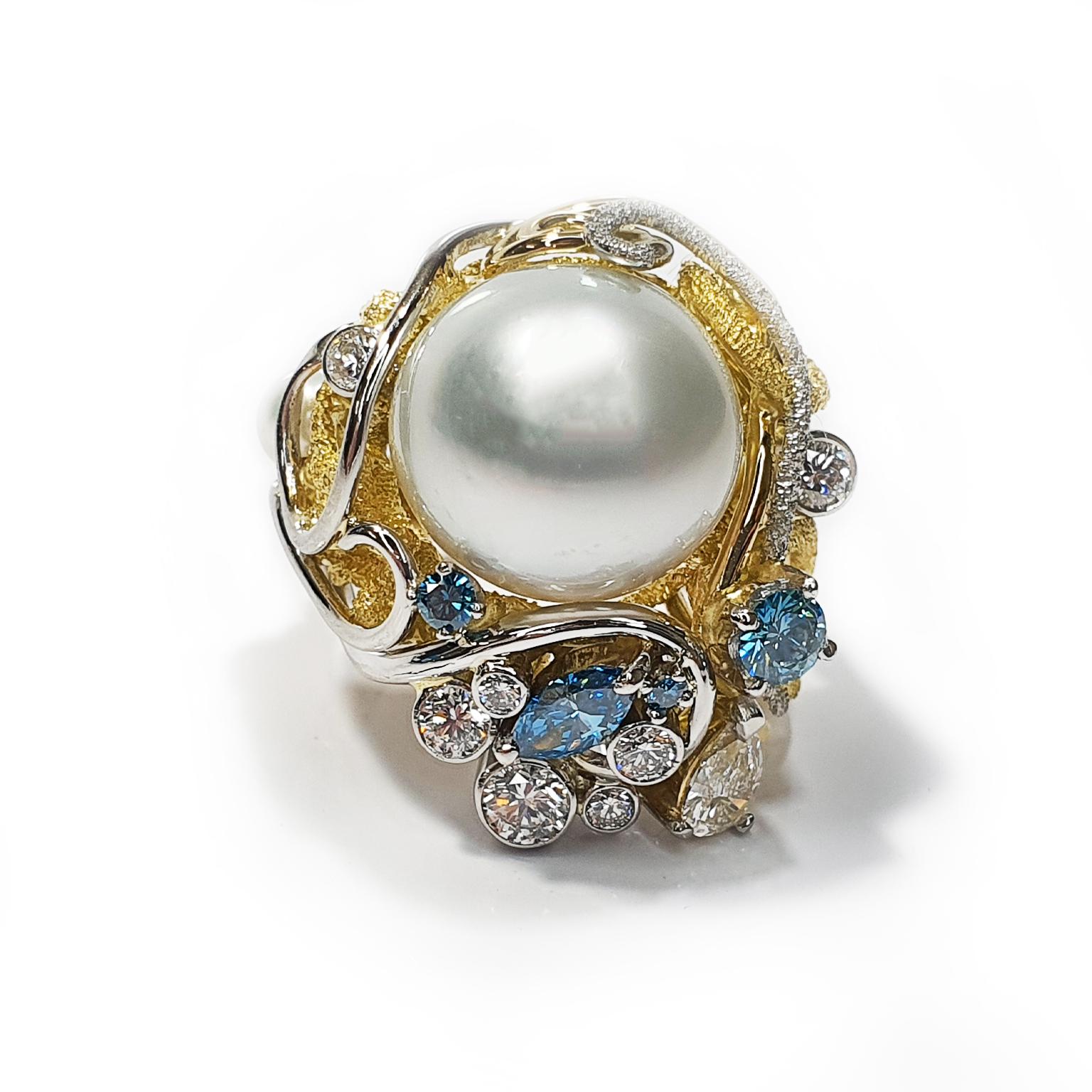 The ring is titled “Harmony” encapsulating the flowing design, catching the movements of the water surging around coral with the pearl as a central feature and bringing into play the beautiful aqua tones of colour enhanced blue diamonds, personally