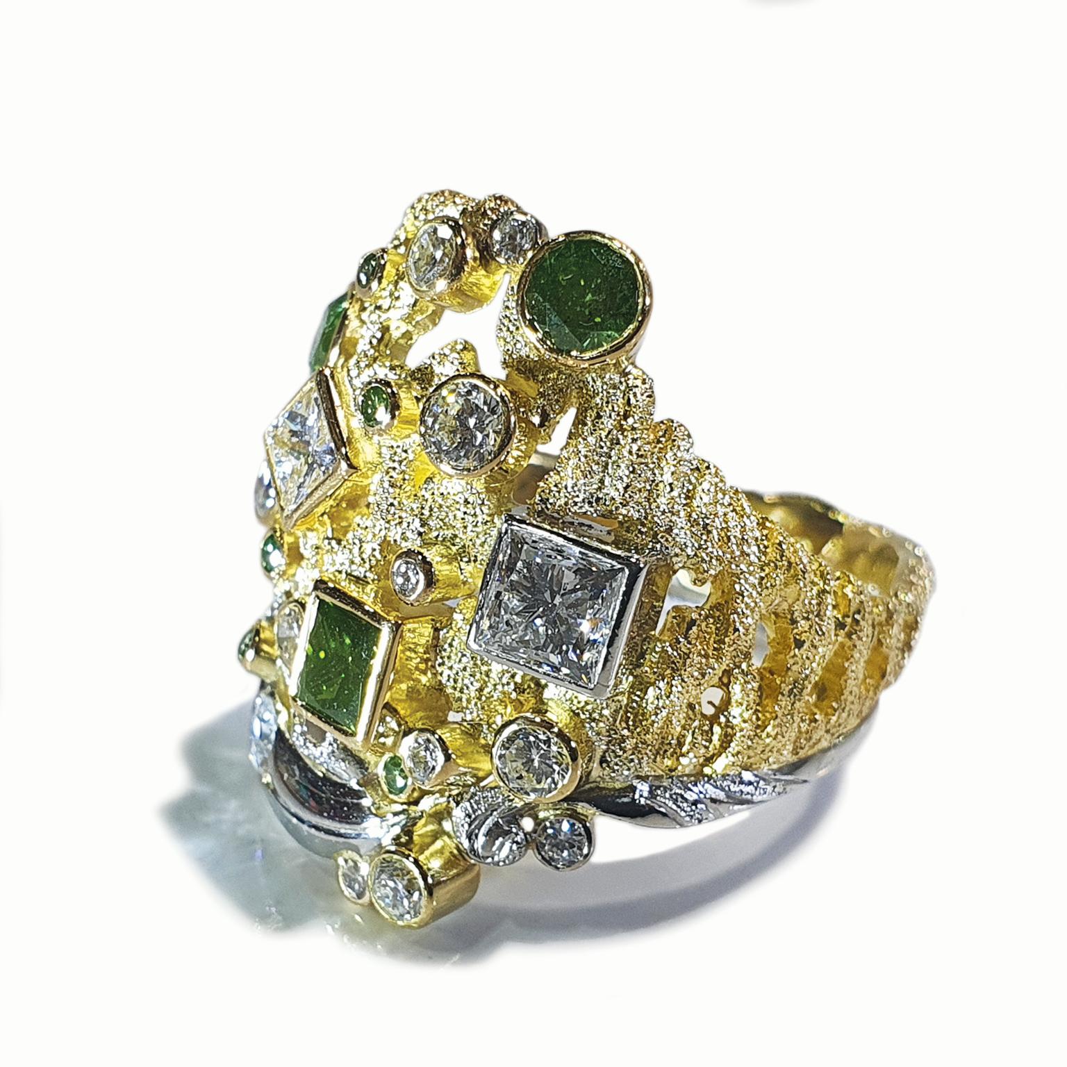 Paul Amey’s “Bark” green and white diamond ring was crafted from 18K yellow gold and platinum.   The “Bark” ring features green colour enhanced natural diamonds and the stylized “Bark” is finished with Paul Amey’s signature texture. The top of the