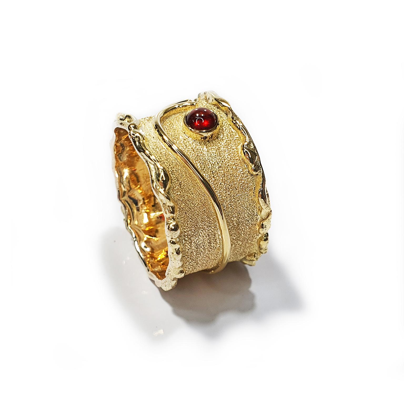 Paul Amey’s signature molten edge garnet ring was created from 9K yellow gold with a 4mm cabochon natural garnet and finished with Paul Amey’s signature texture. This style of ring is easy to wear every day.  The face of the ring is 1.9cm across