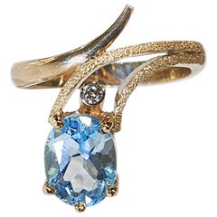 Bague Paul Amey en or 9 carats, diamants et topaze bleue