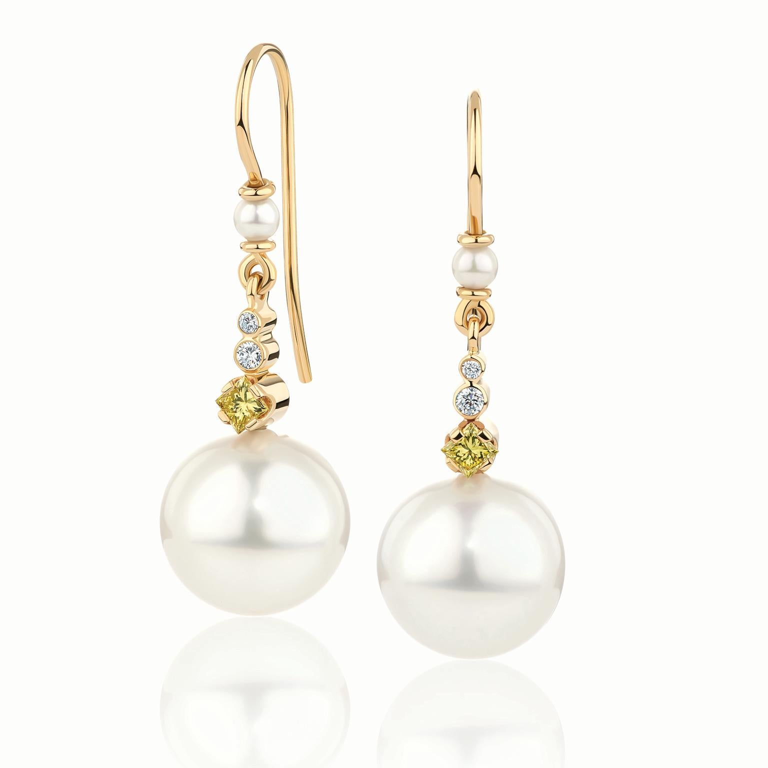 Paul Amey’s South Sea pearl and diamond earrings were crafted from 18K yellow gold with hand crafted shepherd's crook fittings.  

At the top of the earring is the 3mm cultured South Sea pearl which is followed by a “loop” pivot. This leads to a 1pt