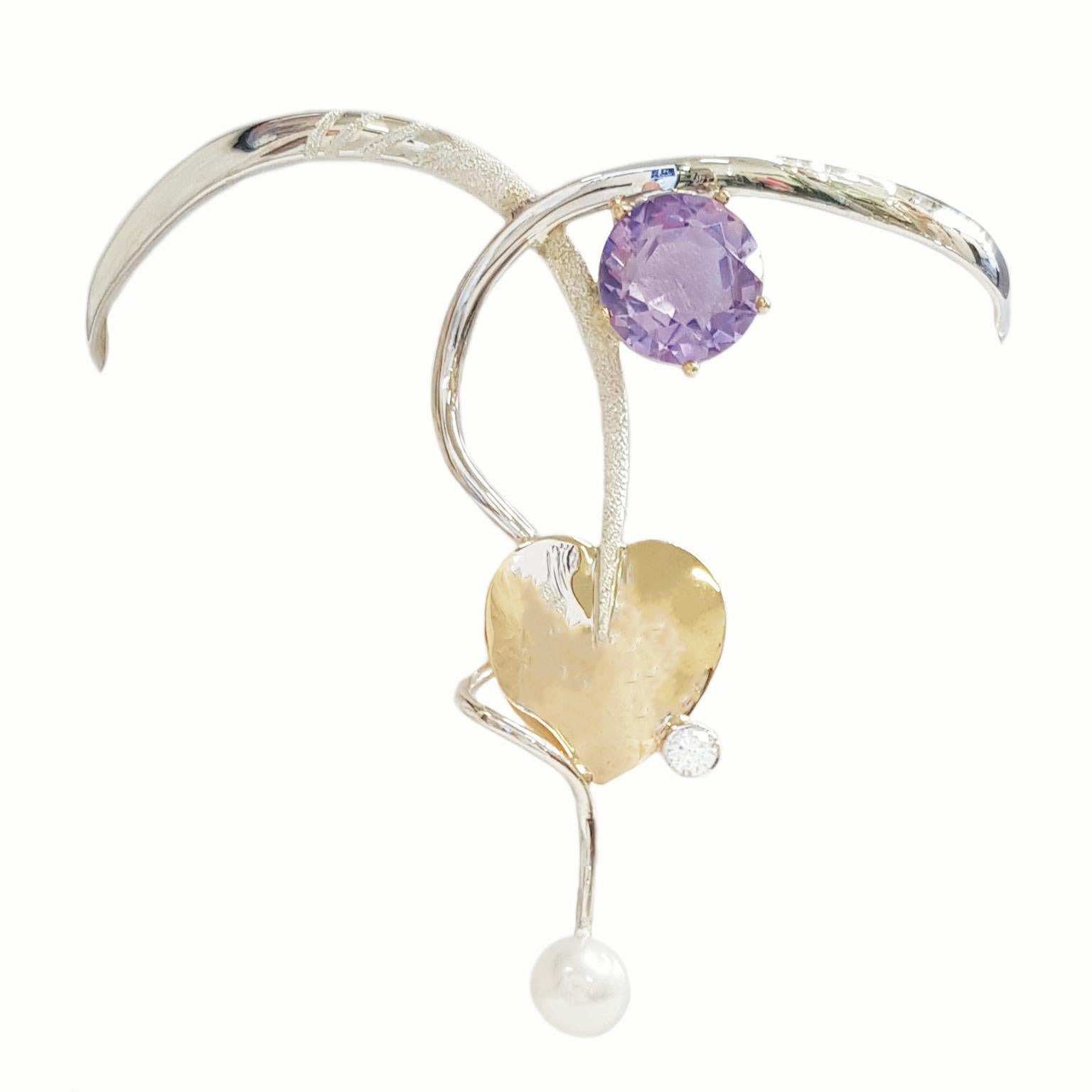 Paul Amey’s armlet bangle is a totally unique and completely handcrafted and created by Paul Amey. This
armlet was crafted from tarnish resistant Sterling Silver, 9K yellow gold, natural amethyst, diamond and pearl.  This armlet has a 9K yellow gold