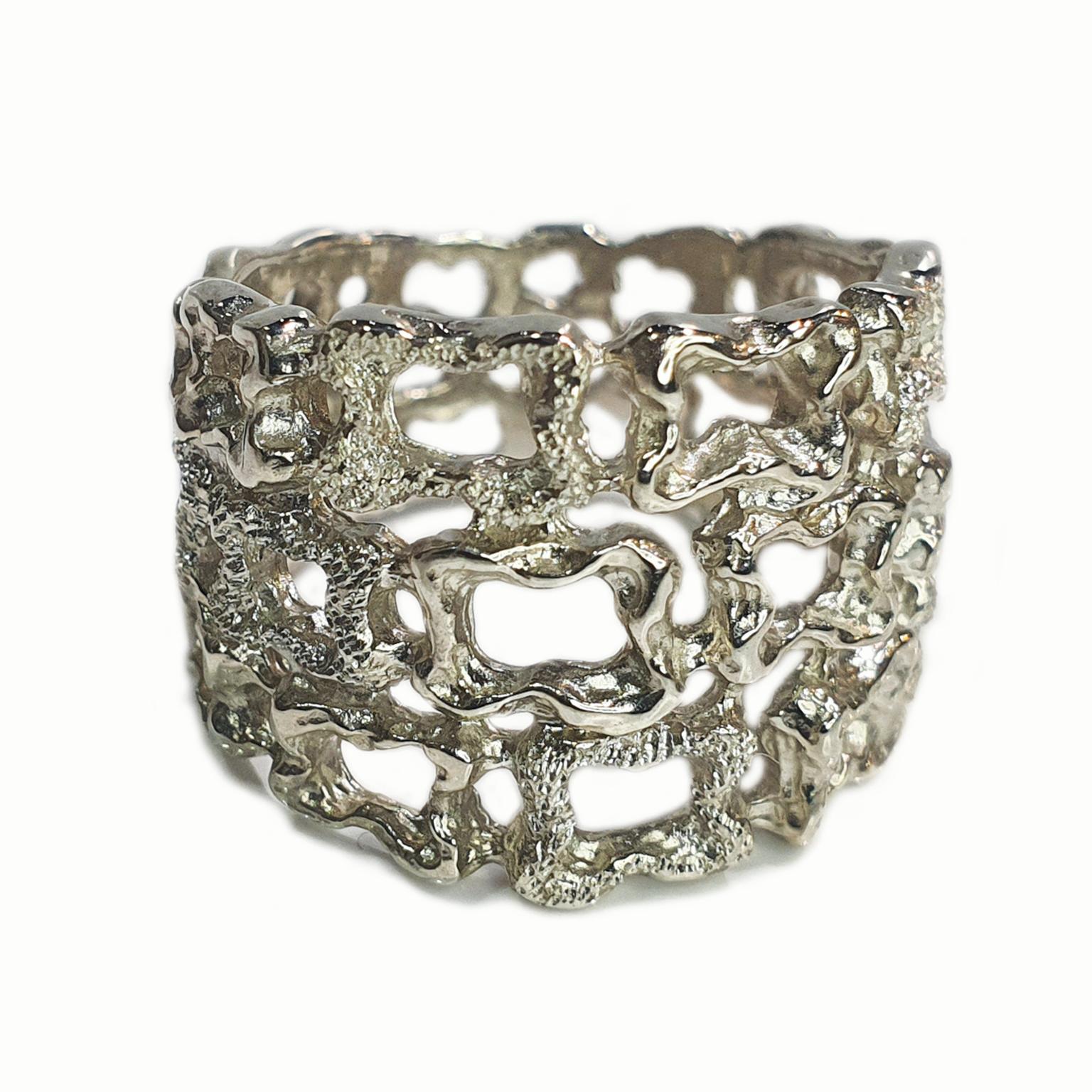 Paul Amey’s Silver Lace ring was crafted from tarnish resistant Sterling Silver. The ring features Paul Amey’s signature lace free form design and pin finish texture. The ring weights 7.2 grams and is currently size O (GB) or 7.5 (US) but can be
