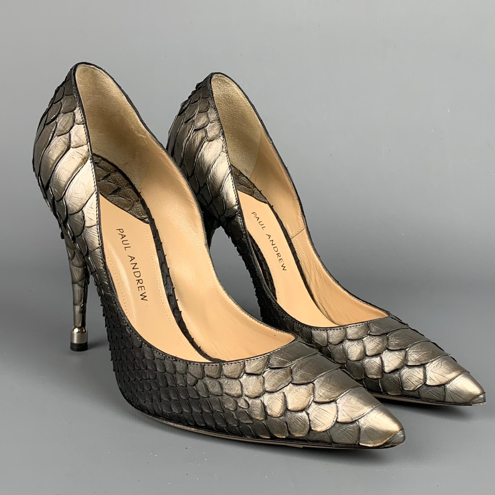 PAUL ANDREW pumps comes in a silver & grey ombre python skin featuring a pointed toe, silver tone hardware, and a stacked heel. Made in Italy.

Very Good Pre-Owned Condition.
Marked: IT 38

Measurements:

Heel: 4.5 in. 
