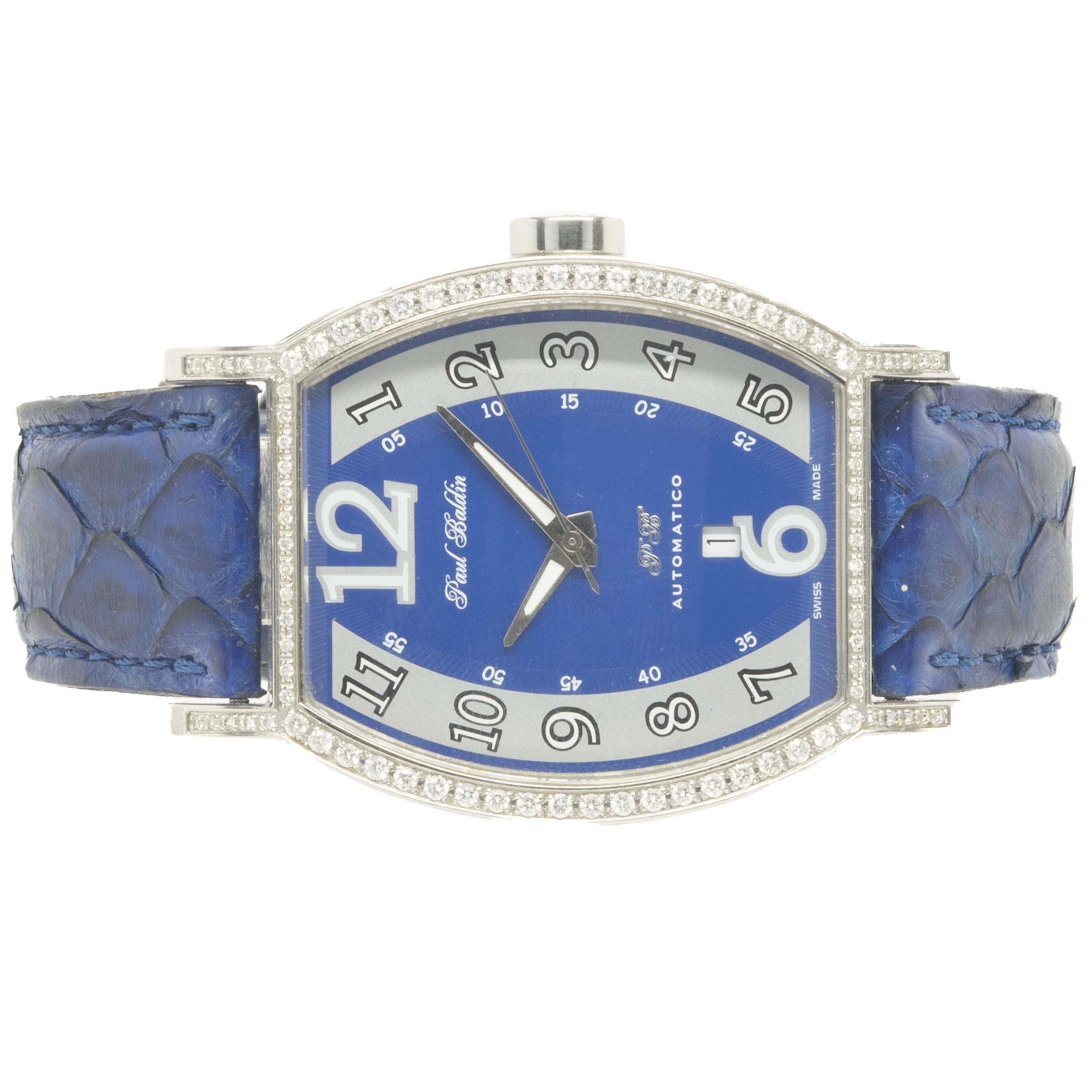 Uhrwerk: automatisch
Funktion: Stunden, Minuten, Sekunden, Datum
Gehäuse: 55 x 40 mm aus Edelstahl, mit Diamanten besetzt, rechteckiges Gehäuse
Zifferblatt: blau-arabisch
Seriennummer N VE/XXX

Keine Box oder Papiere
Die Echtheit wird vom Verkäufer